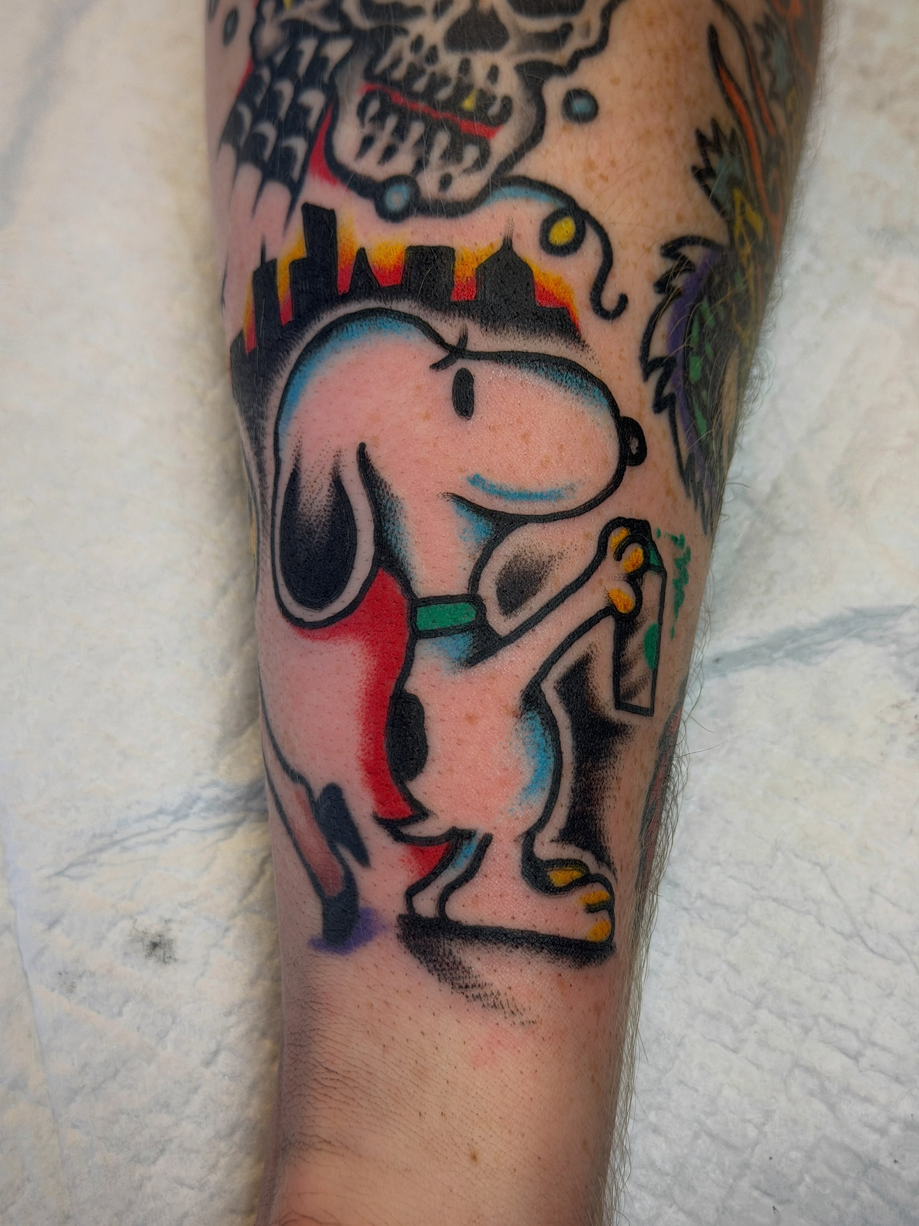 Snoopy American traditional tattoo on the forearm by Joshua Speight