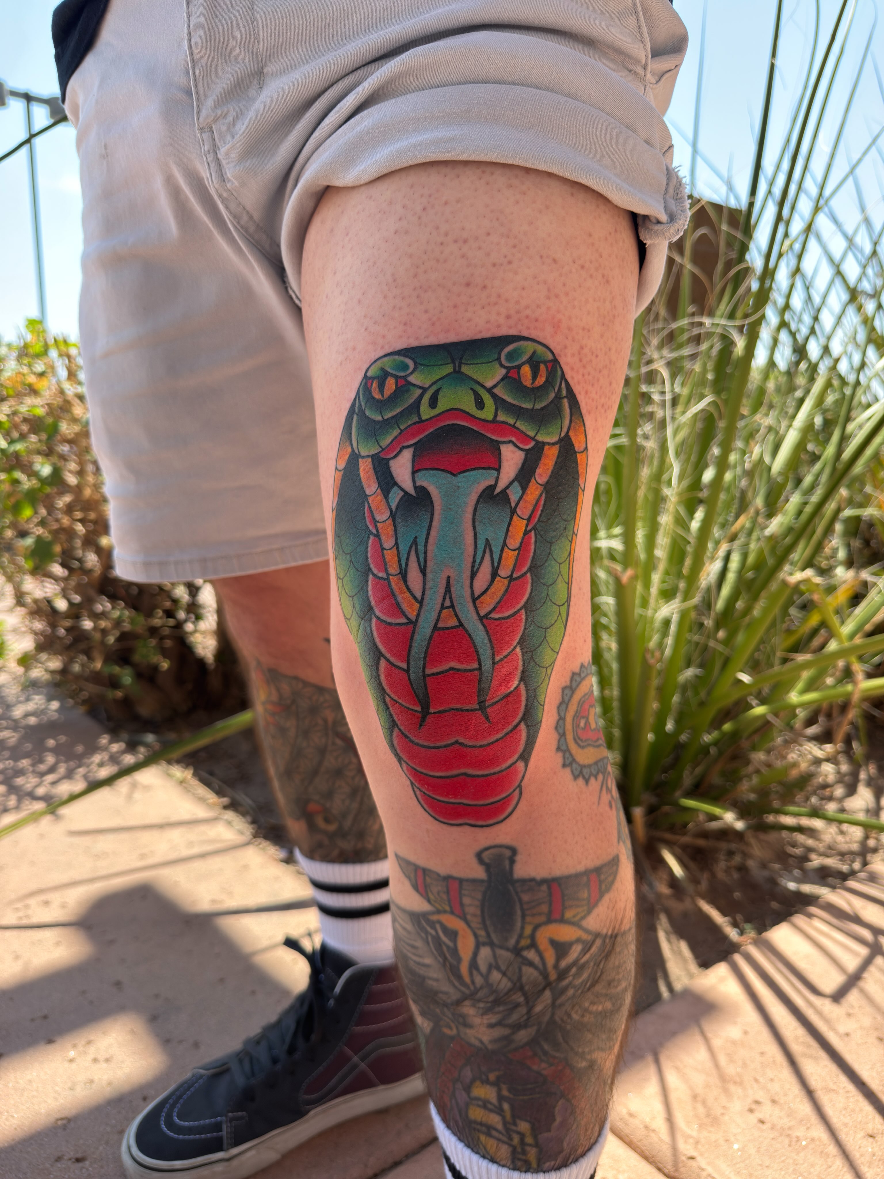 Snake American traditional tattoo on the thigh by Donovan hernandez