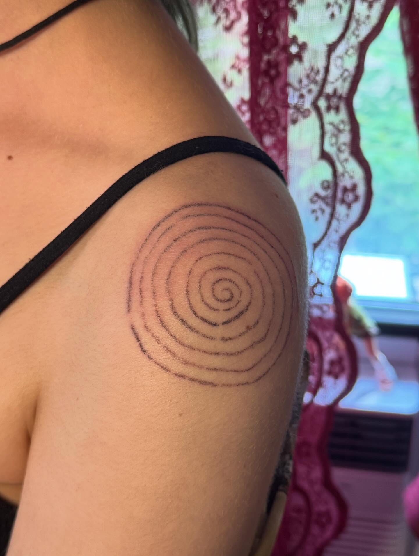 Spiral geometric tattoo on the shoulder by mar