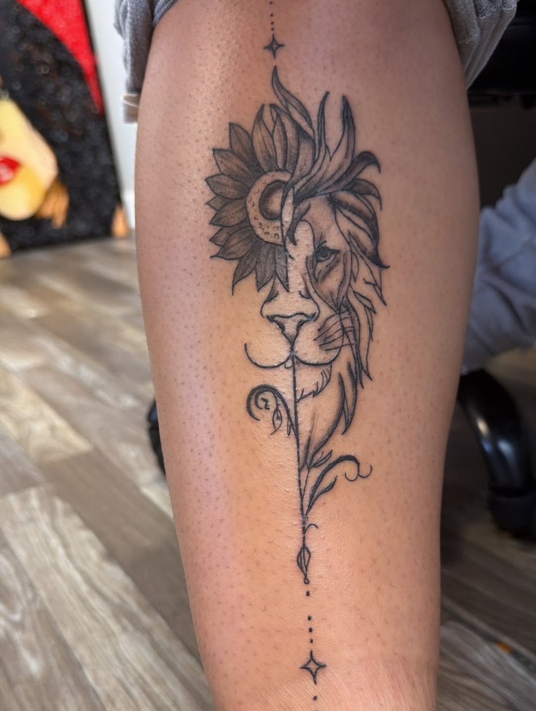 Lion and sunflower yin yang ornamental tattoo on the thigh by XoXandrea.Ink, Kansas City, Missouri