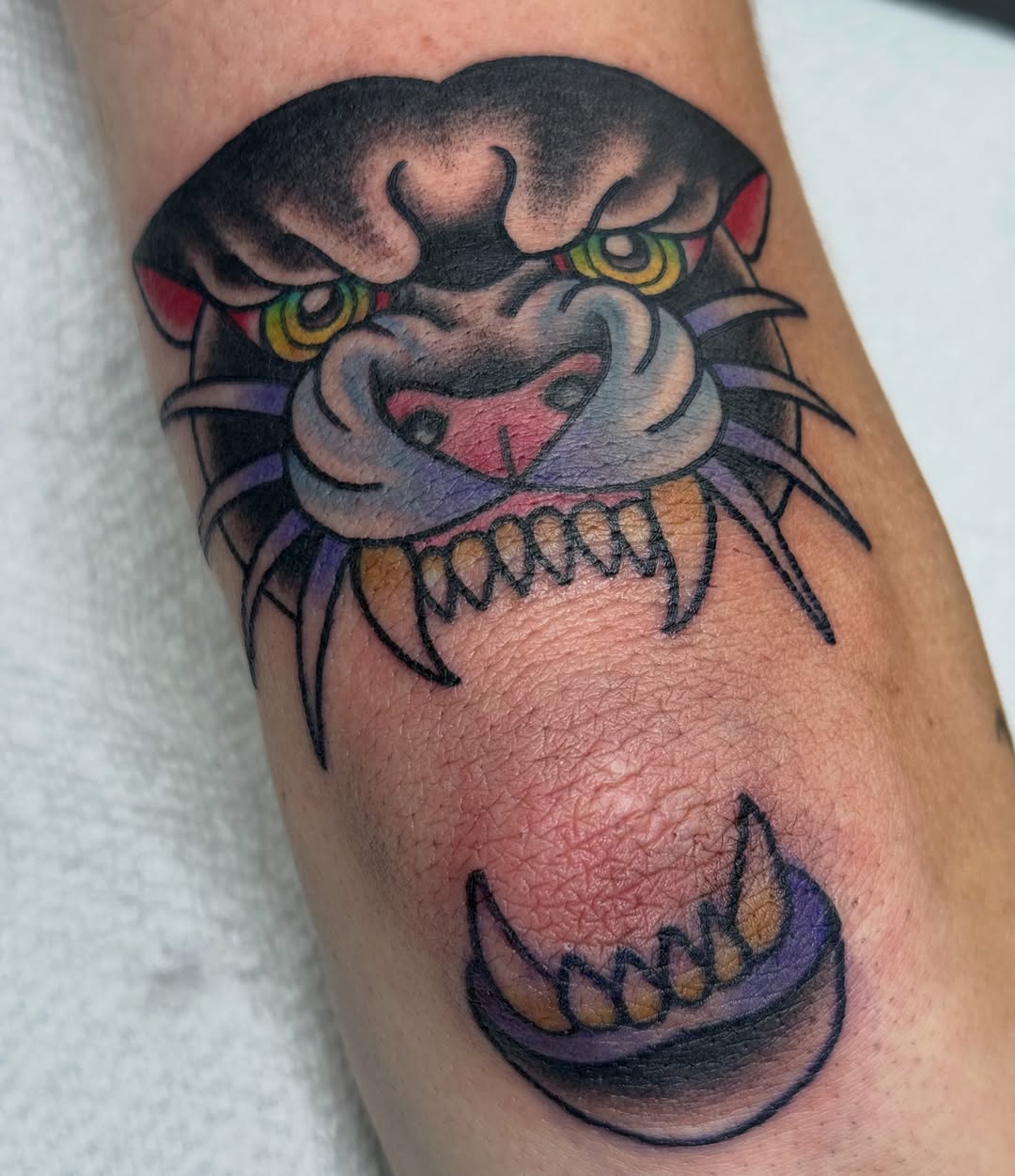 Panther head realism tattoo on the forearm by Kara Mosqueda