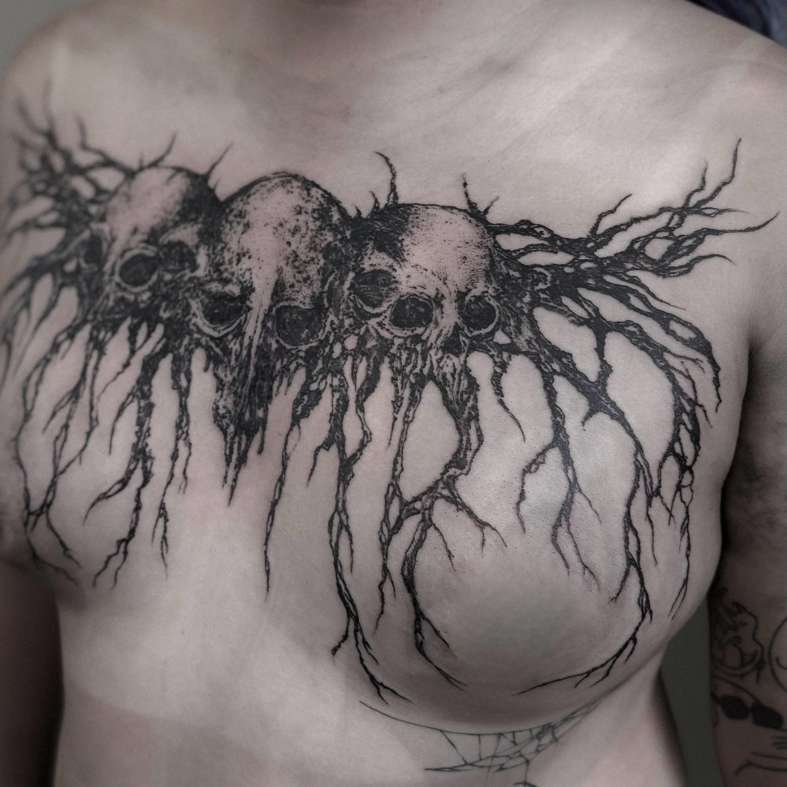 Skulls and roots dotwork tattoo on the chest by ąʑཞąıą ཞąıŋ