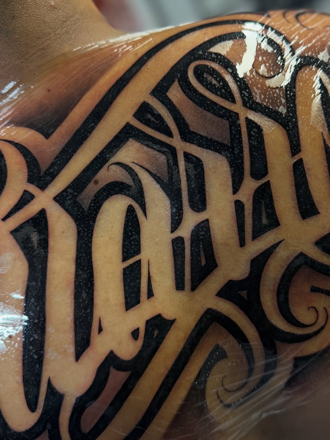 Tattoo by @rockyg_inkz — lettering_script, blackwork