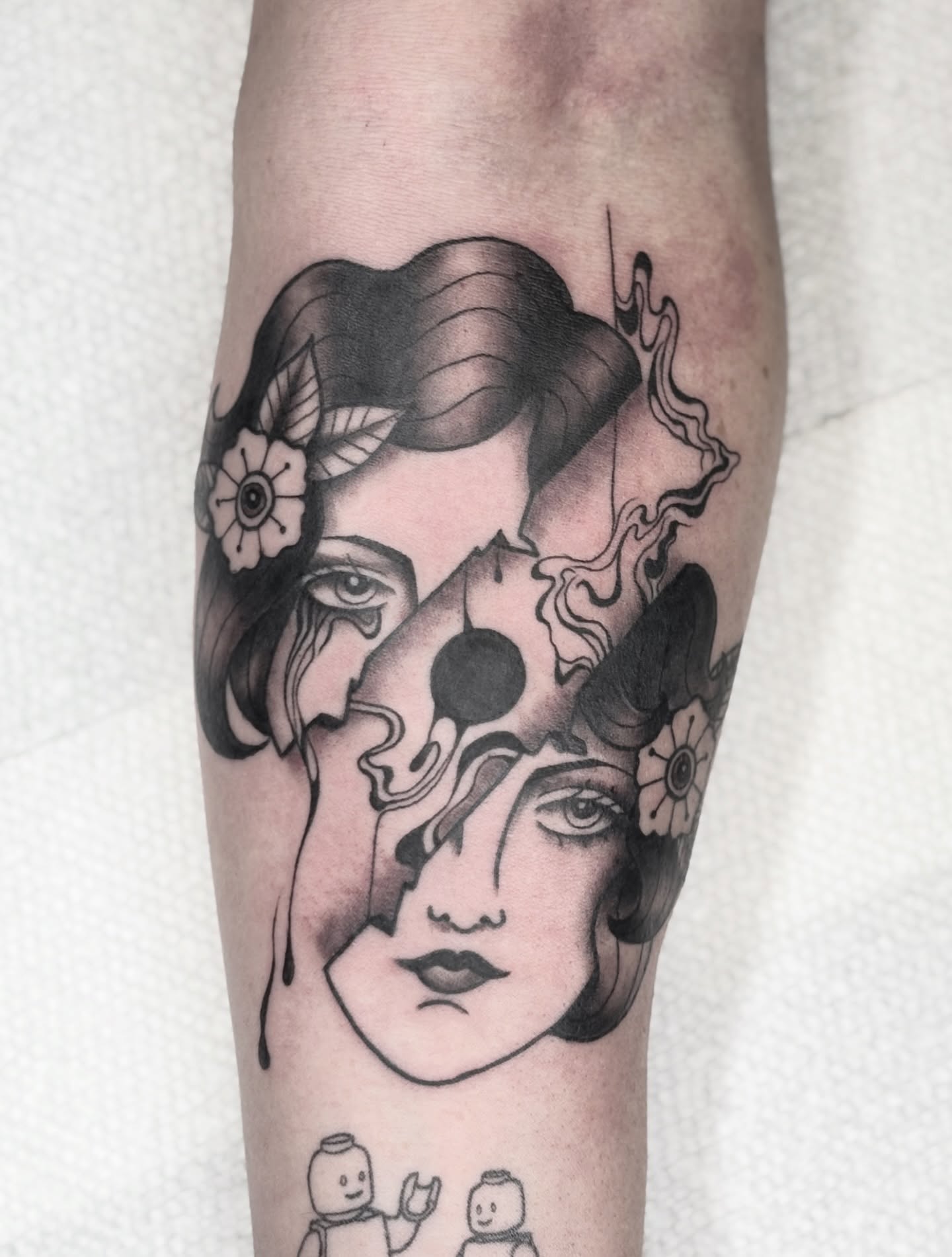 Abstract woman surrealism tattoo on the forearm by MJ Saunders