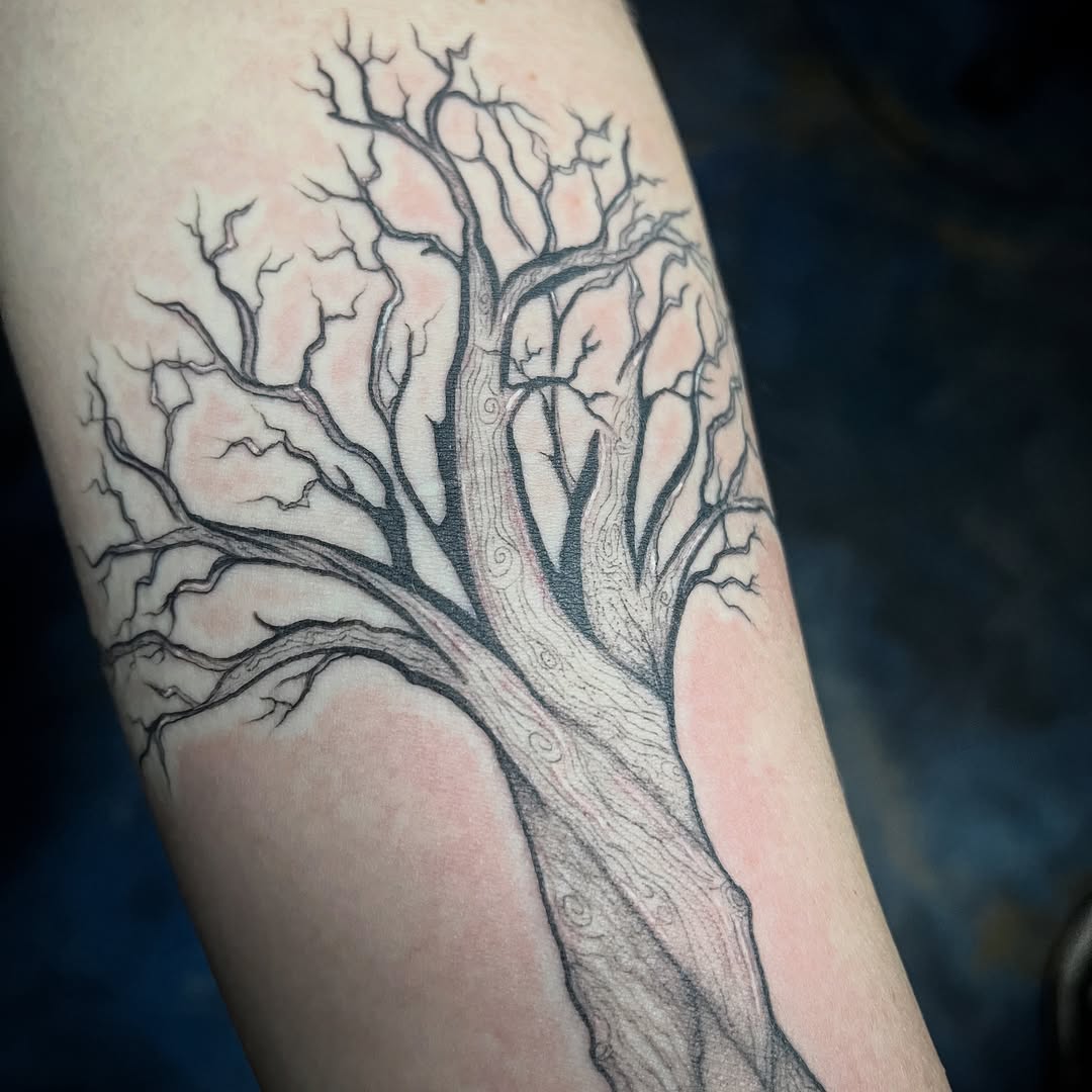 Bare tree dark art tattoo on the forearm by Sid