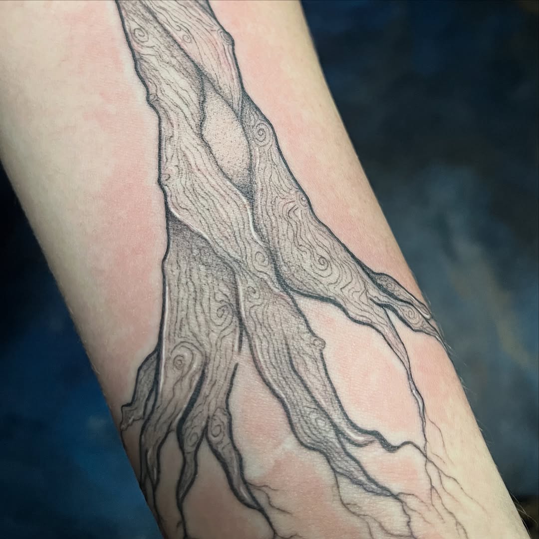 Tree roots dark art tattoo on the forearm by Sid