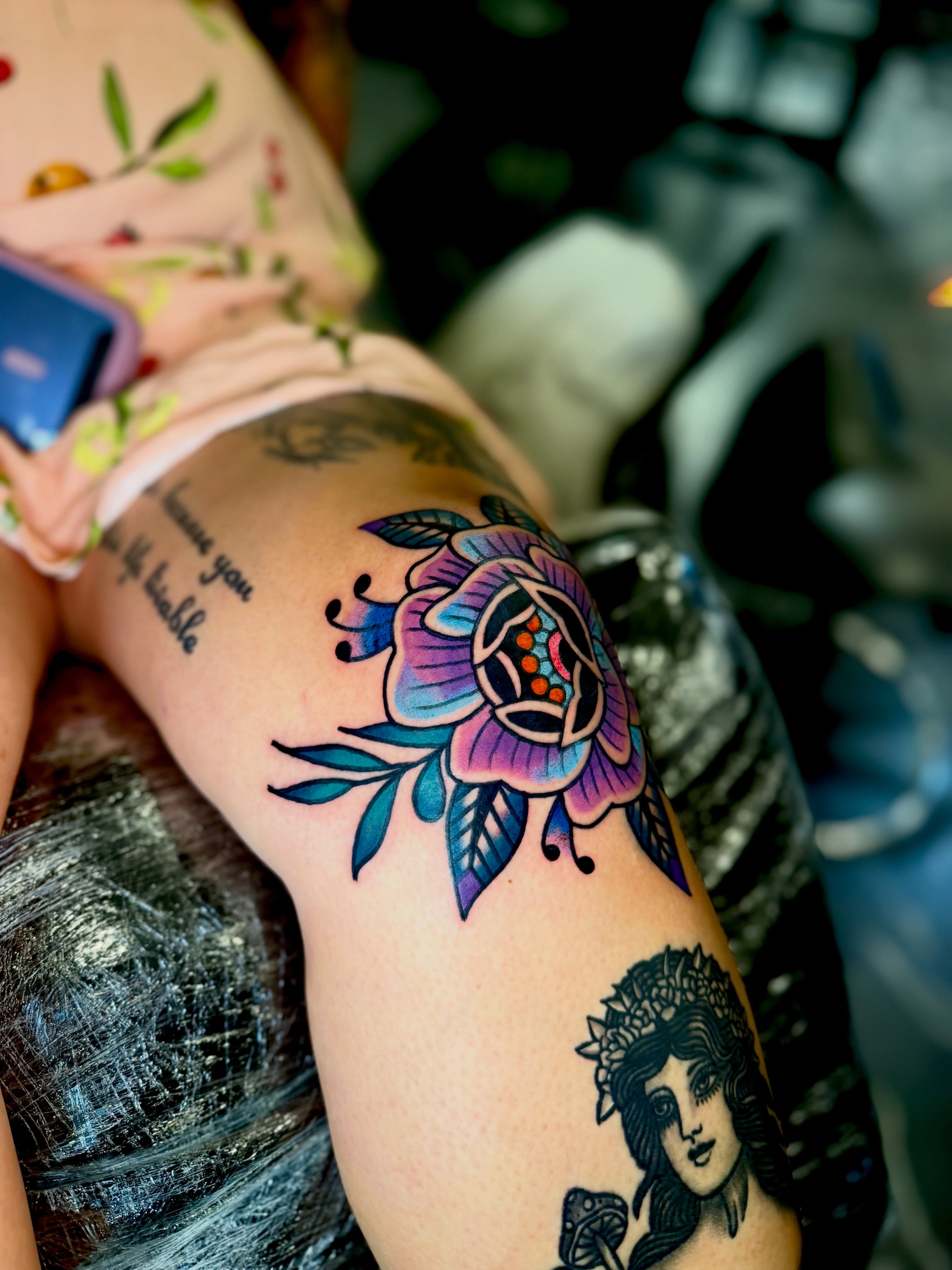 Floral design American traditional tattoo on the thigh by Barbara Gonzalez