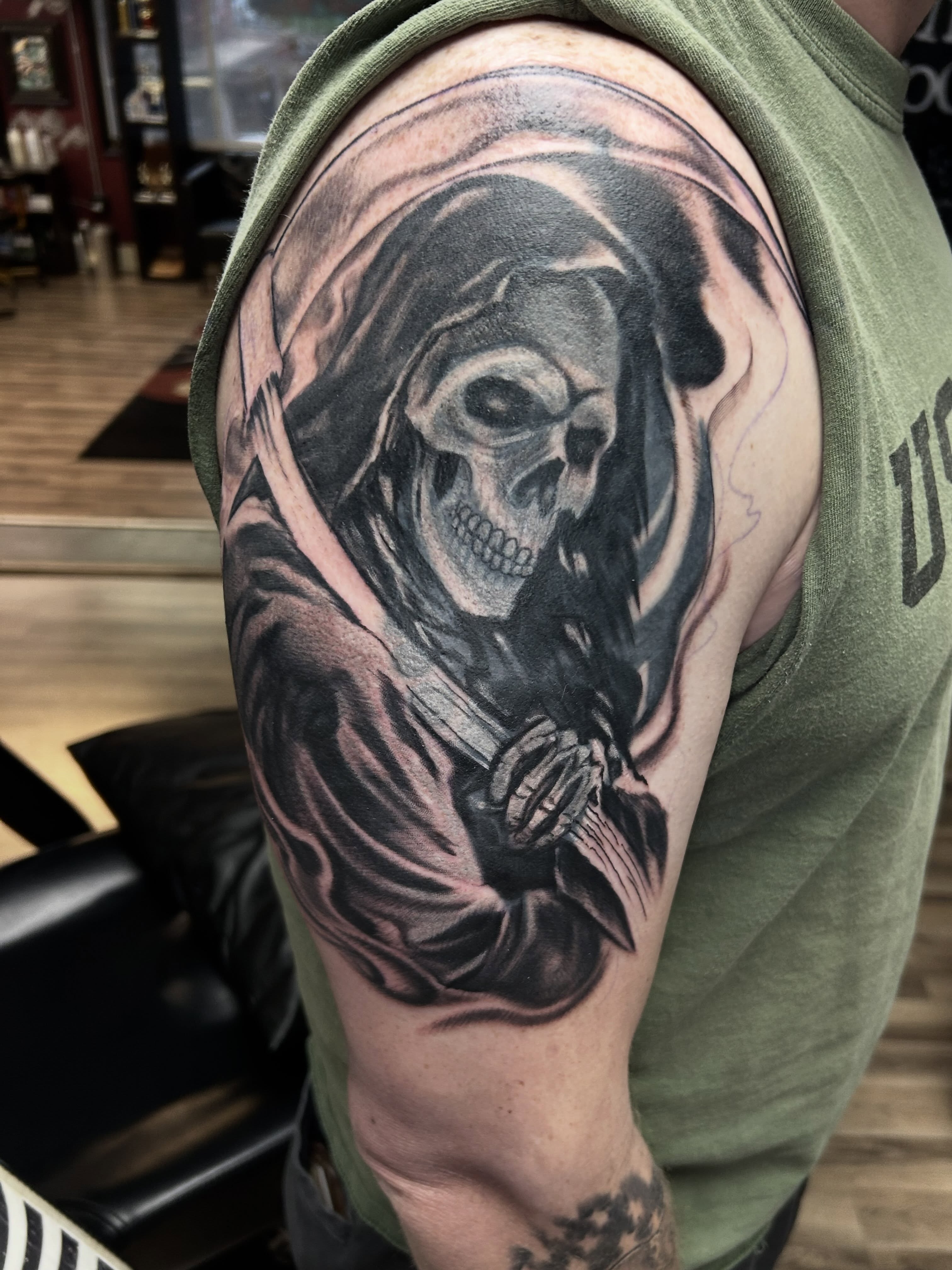 Reaper realism tattoo on the shoulder by Dan Schuster
