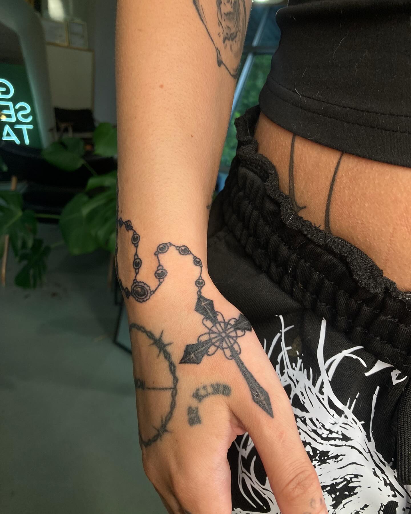 Rosary and cross black and grey tattoo on the forearm by james <3