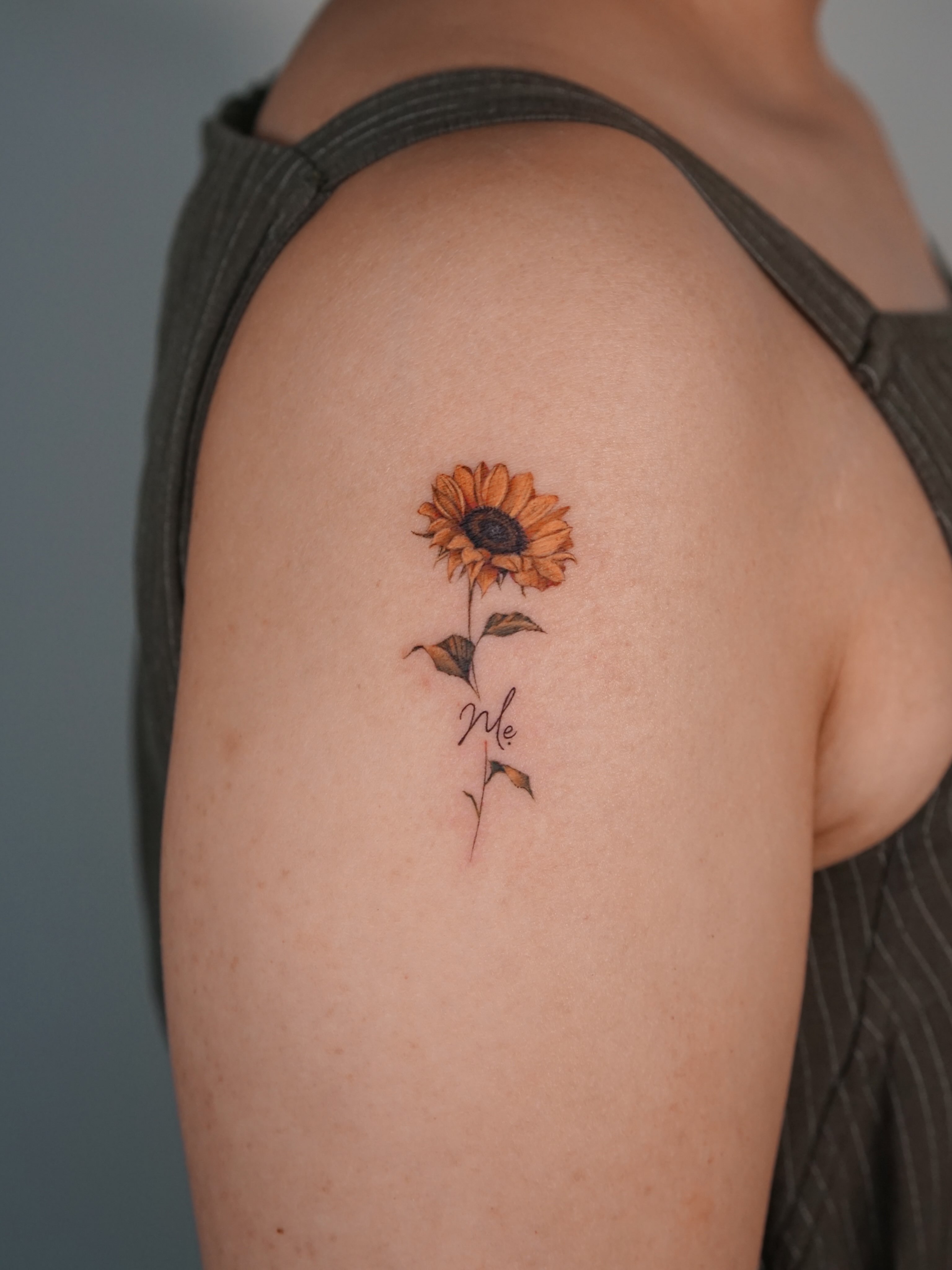 Sunflower realism tattoo on the shoulder by Alissa Jung