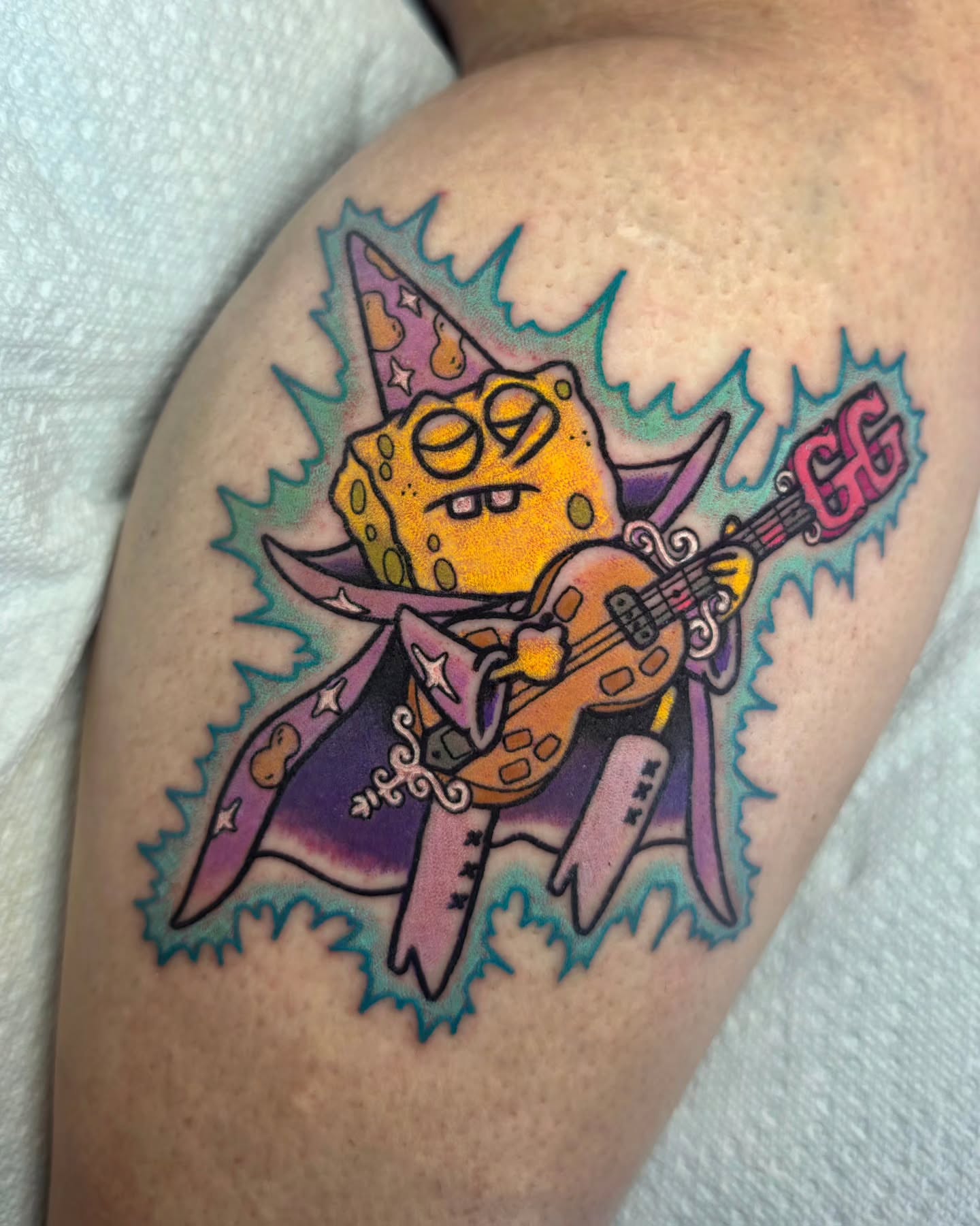 Spongebob playing guitar American traditional tattoo on the thigh by 𝔎𝔦𝔯𝔞 𝔅𝔦𝔰𝔥𝔬𝔭