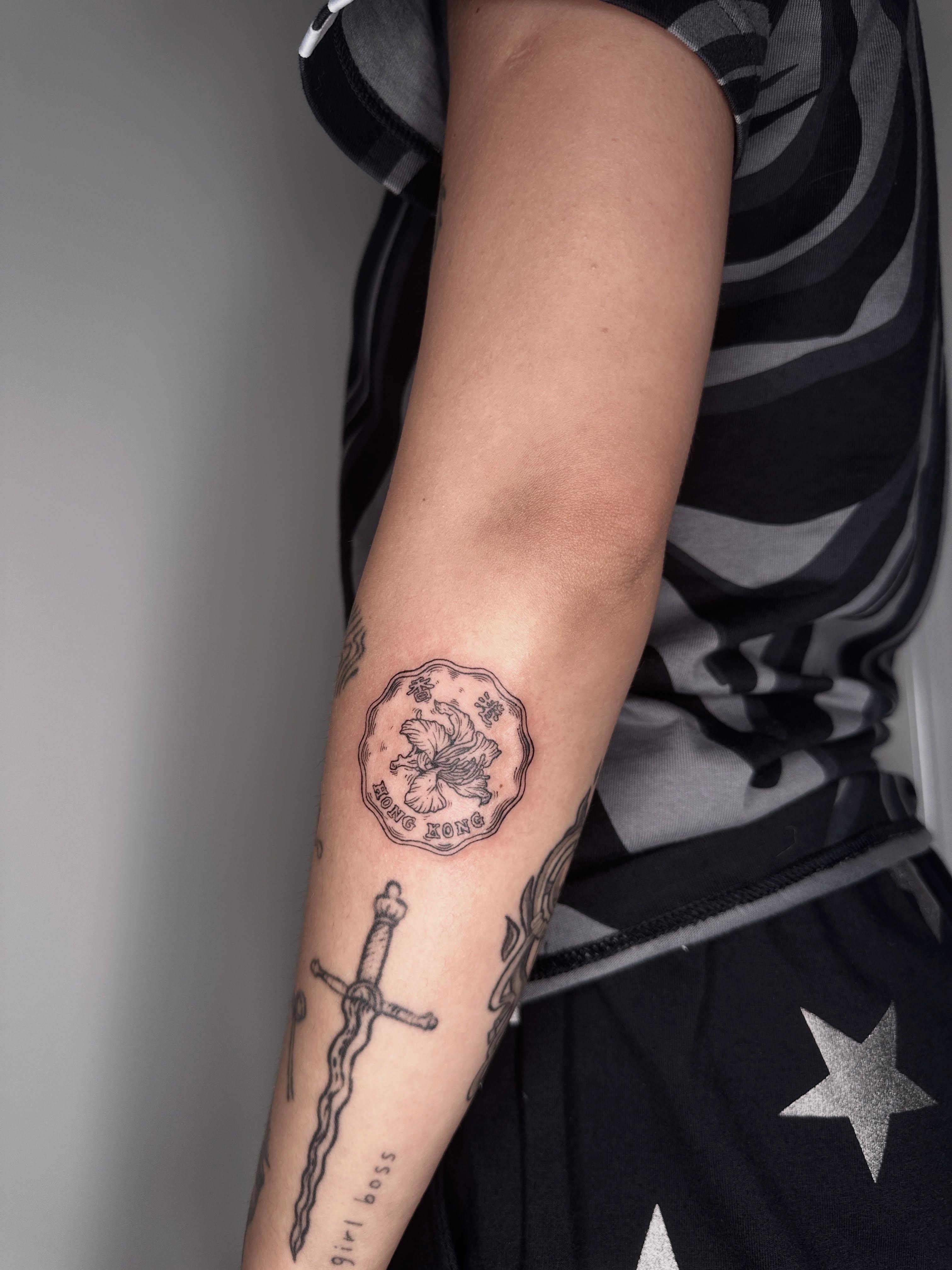 Lion and shield black and grey tattoo on the forearm by Zecember