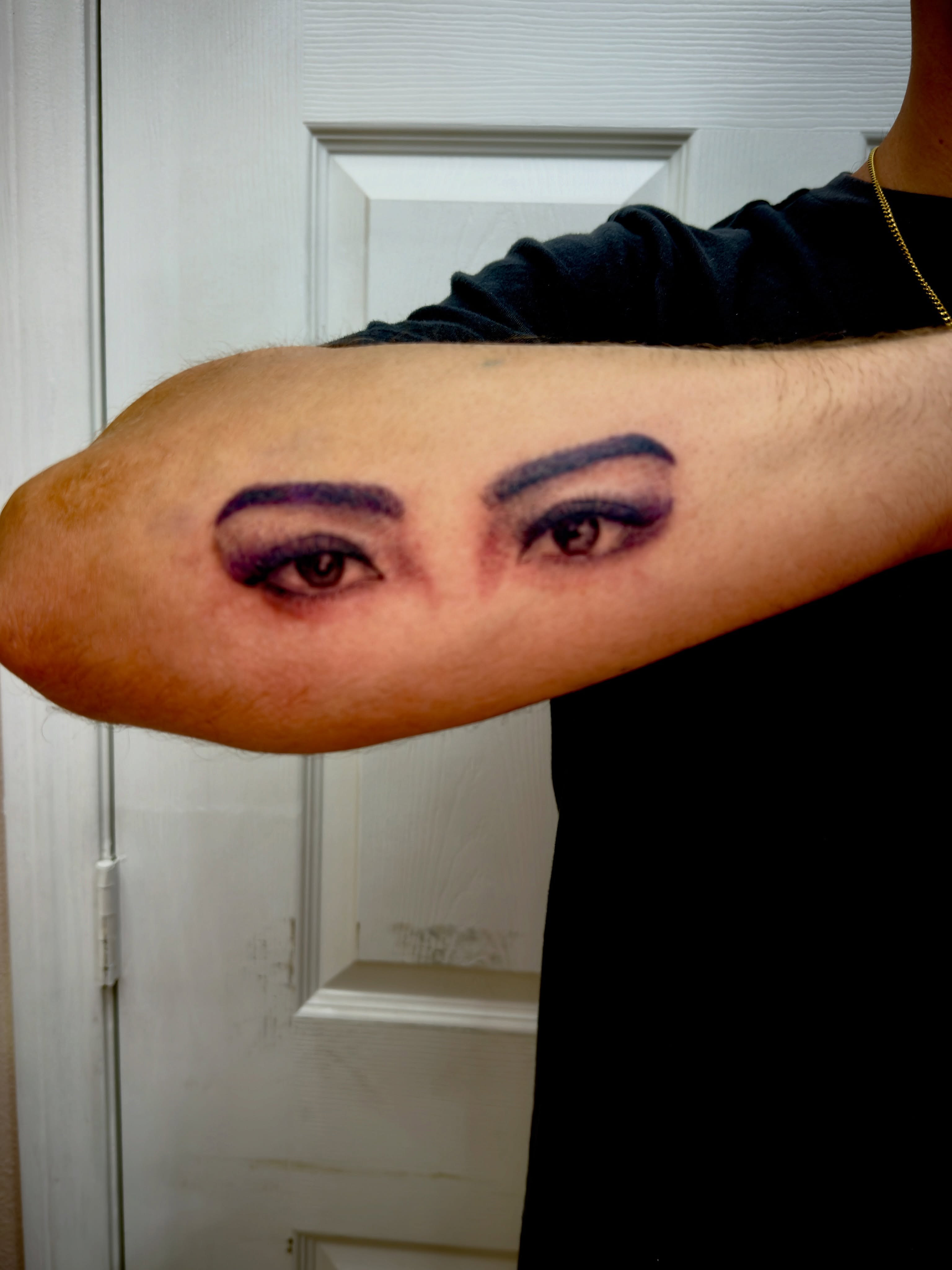 Eyes realism tattoo on the forearm by Caloy Obra