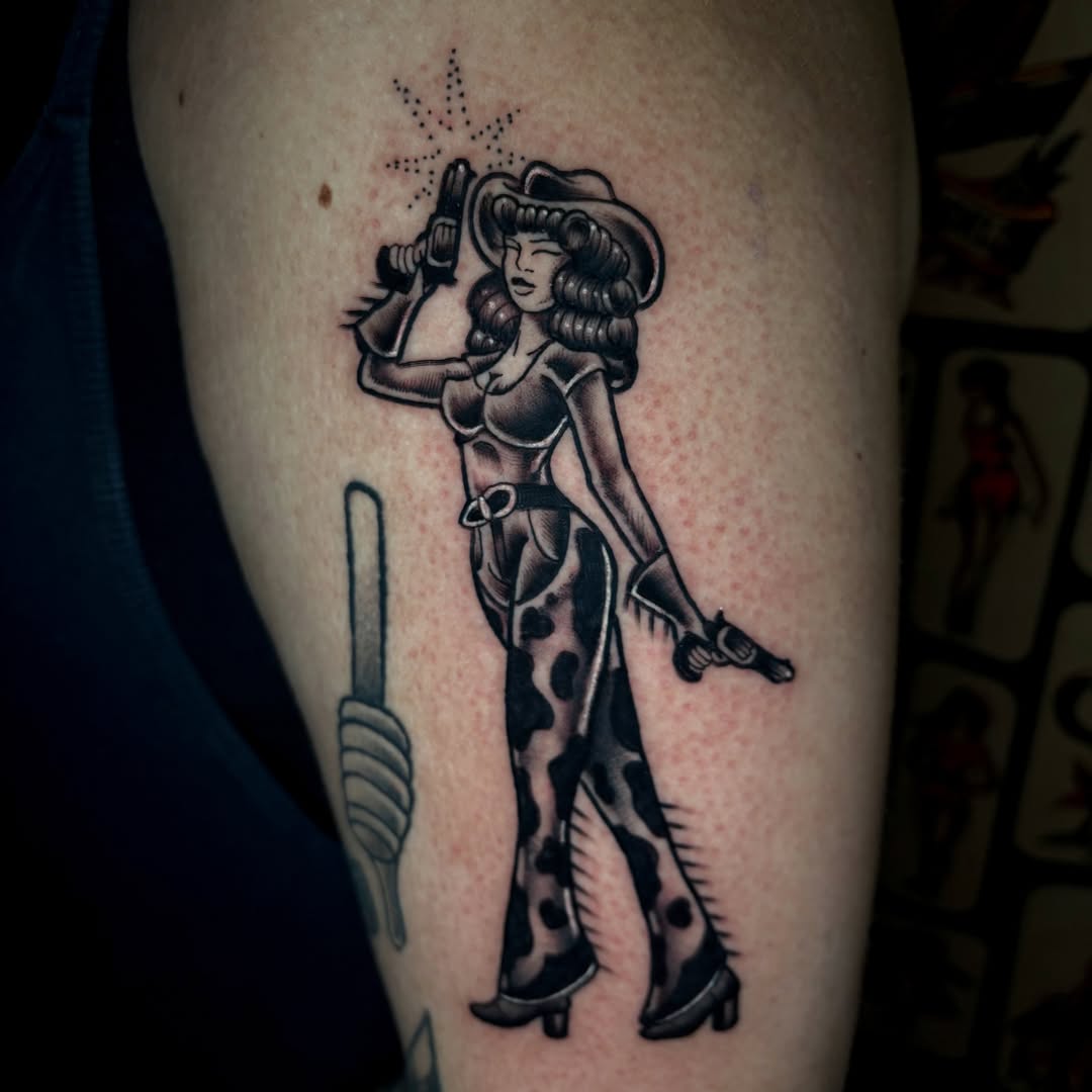 Cowgirl American traditional tattoo on the thigh by Ashley Lin Las Vegas Tattoo Artist