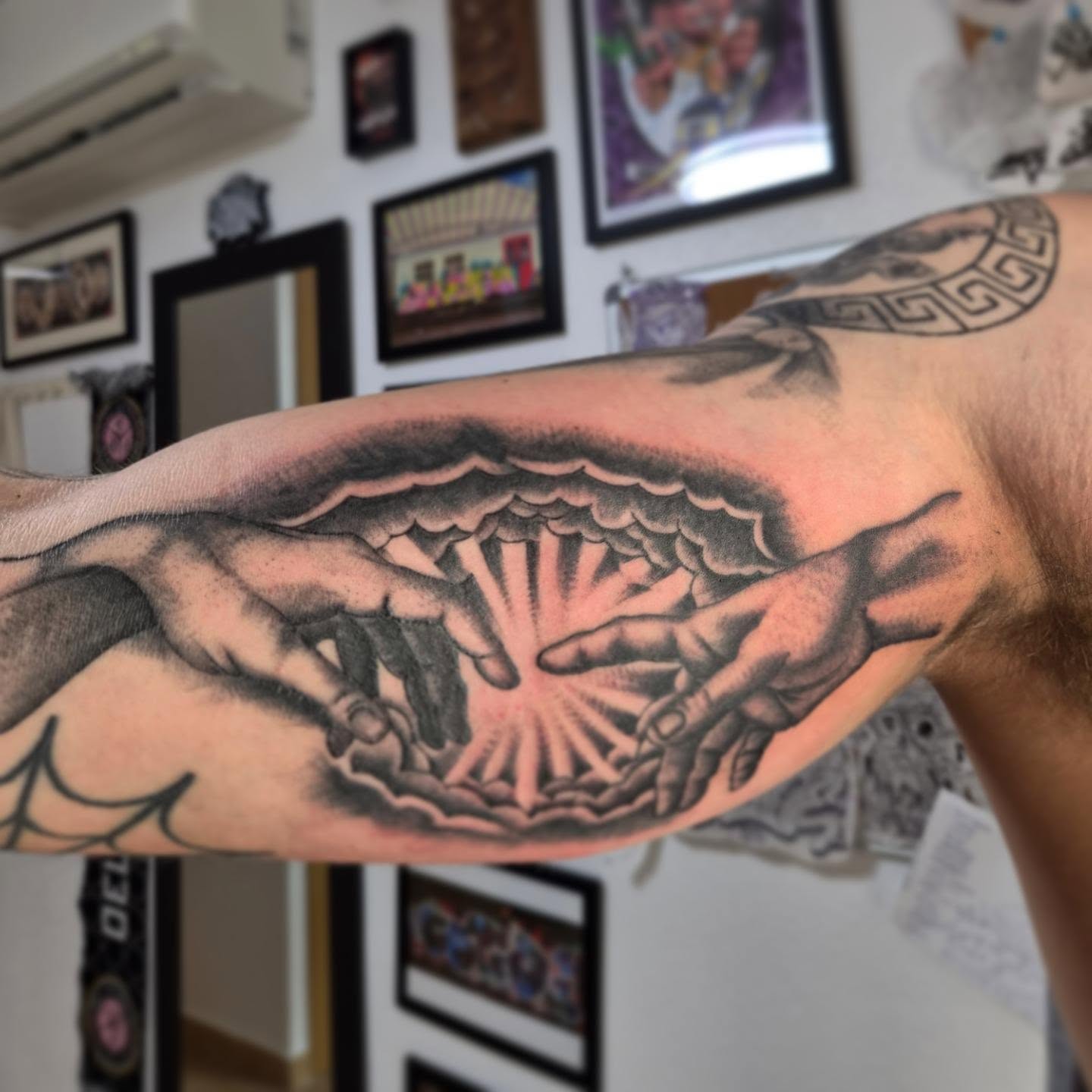 Hands and sunburst realism tattoo on the forearm by Gonzalo Pantona