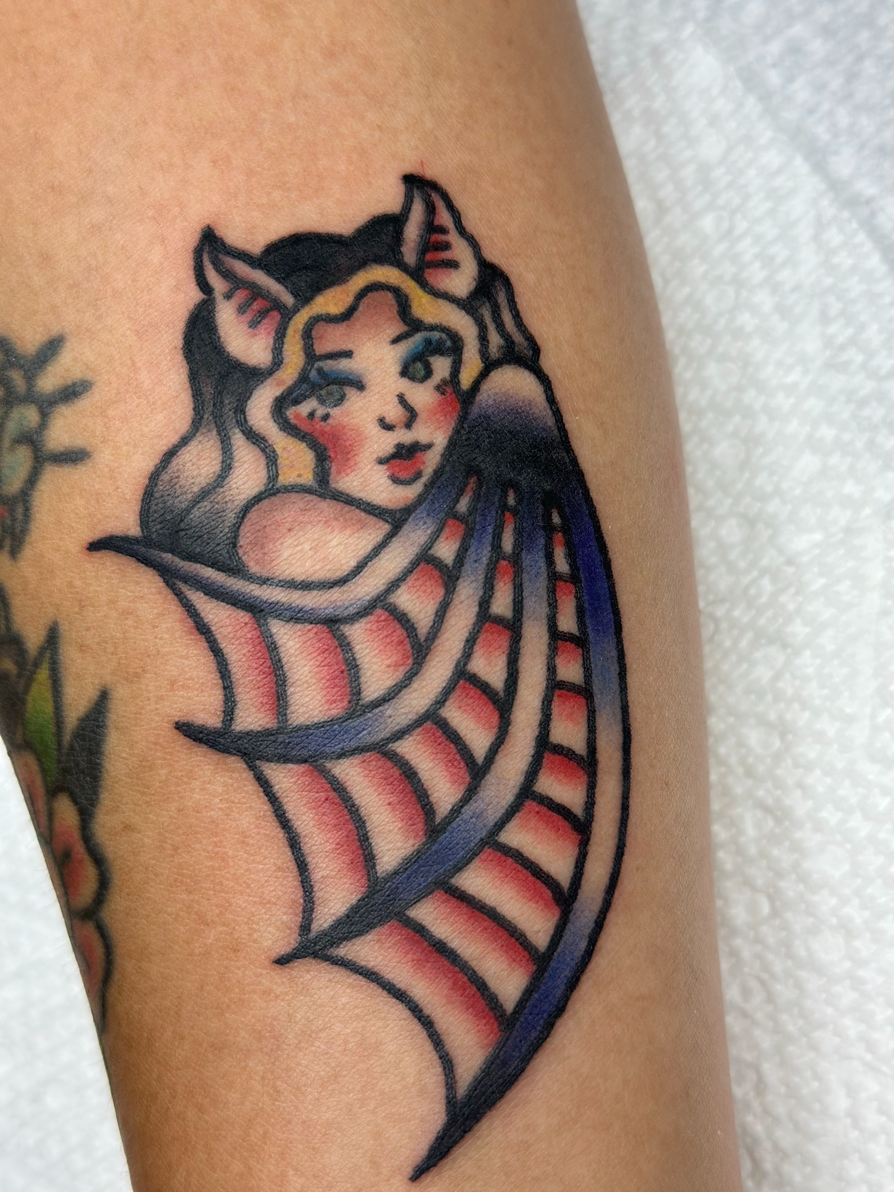 Demon girl American traditional tattoo on the forearm by Lucy Jay