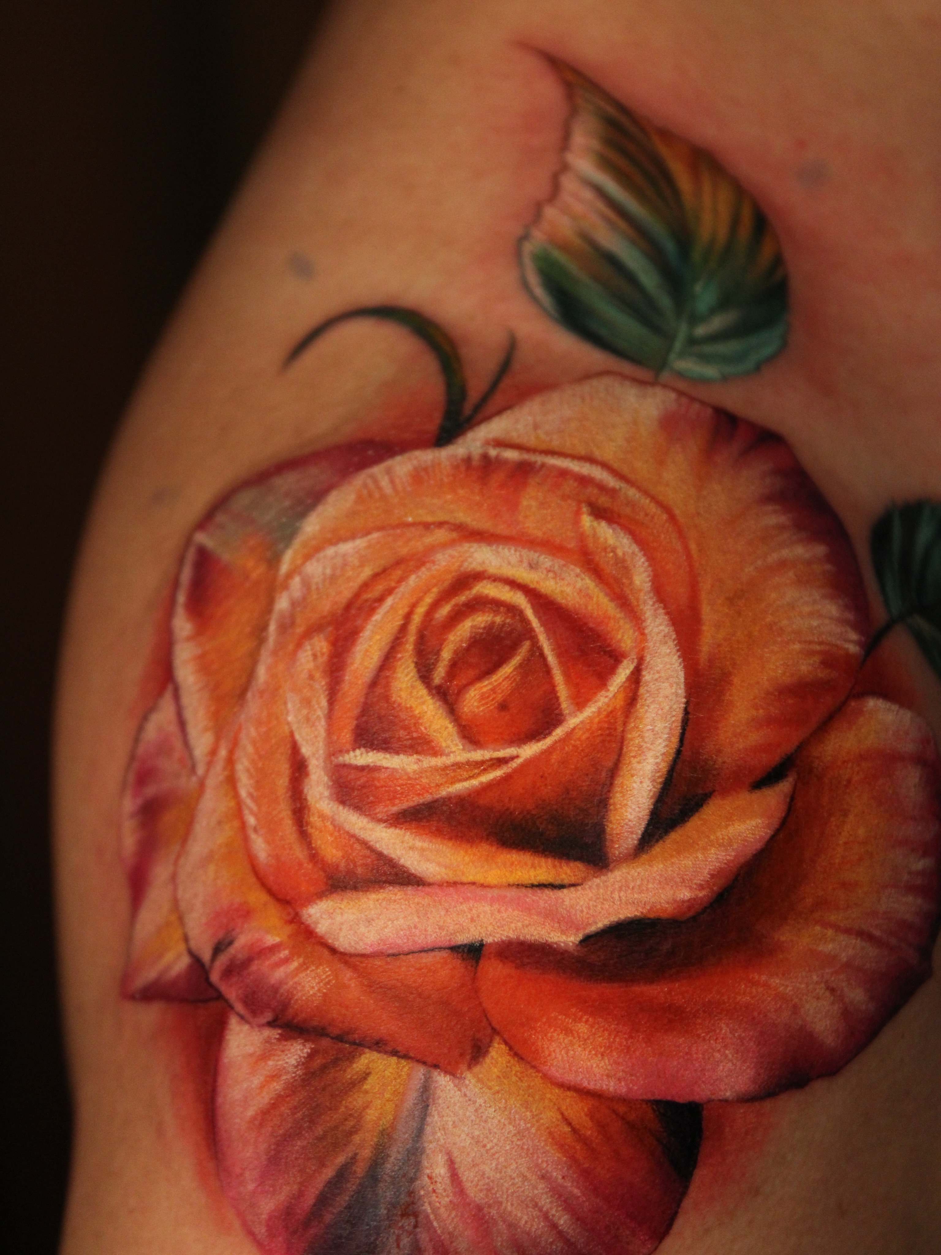 Rose realism tattoo on the shoulder by Eva Williams
