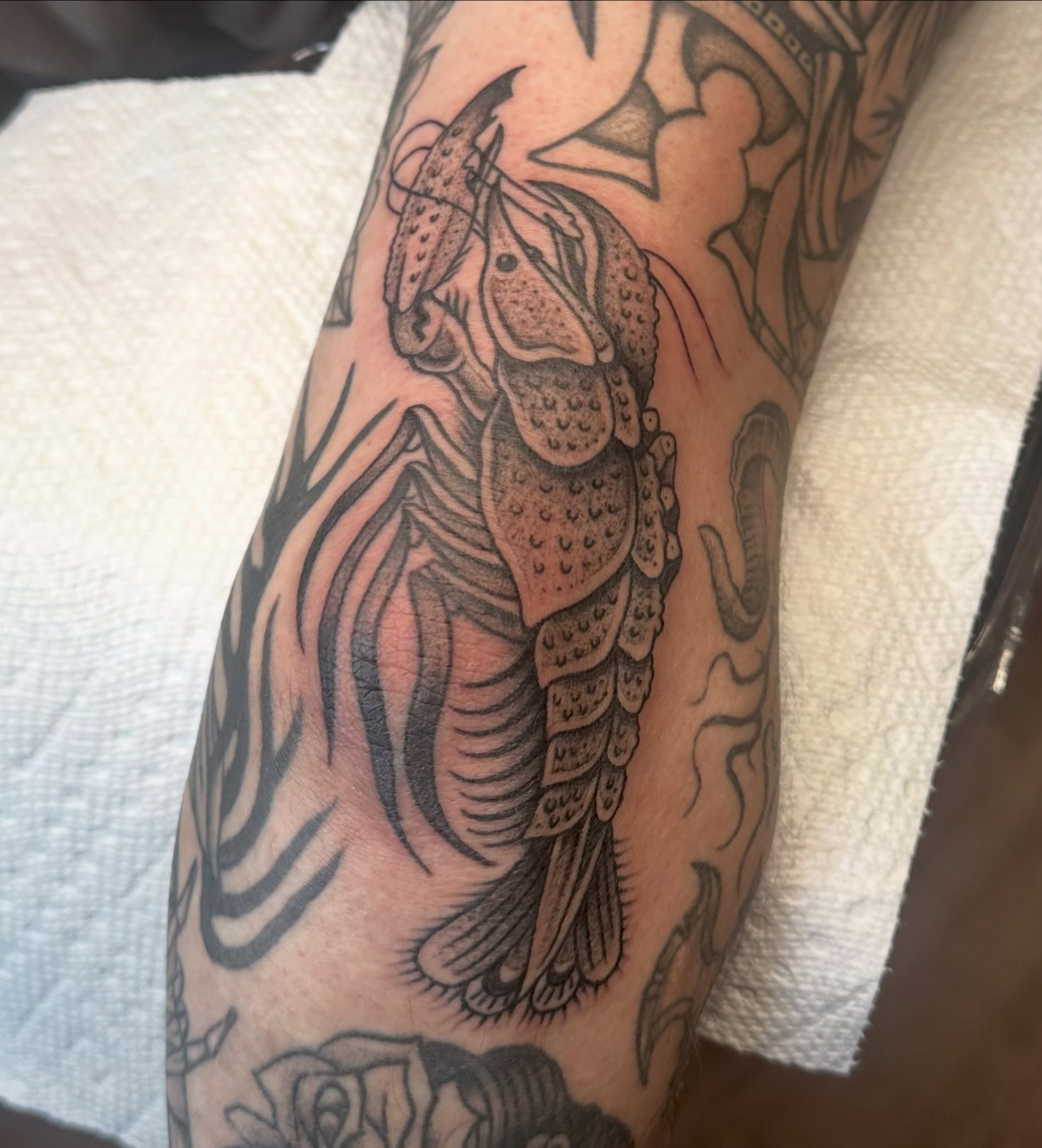 Lobster American traditional tattoo on the forearm by Lia Massari