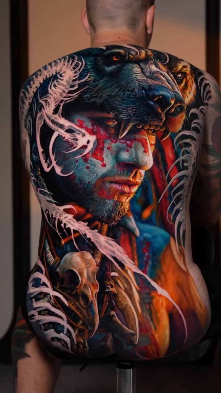 Warrior with wolf headdress surrealism tattoo on the upper arm by Hiroto Nguyen, Perth, Western Australia