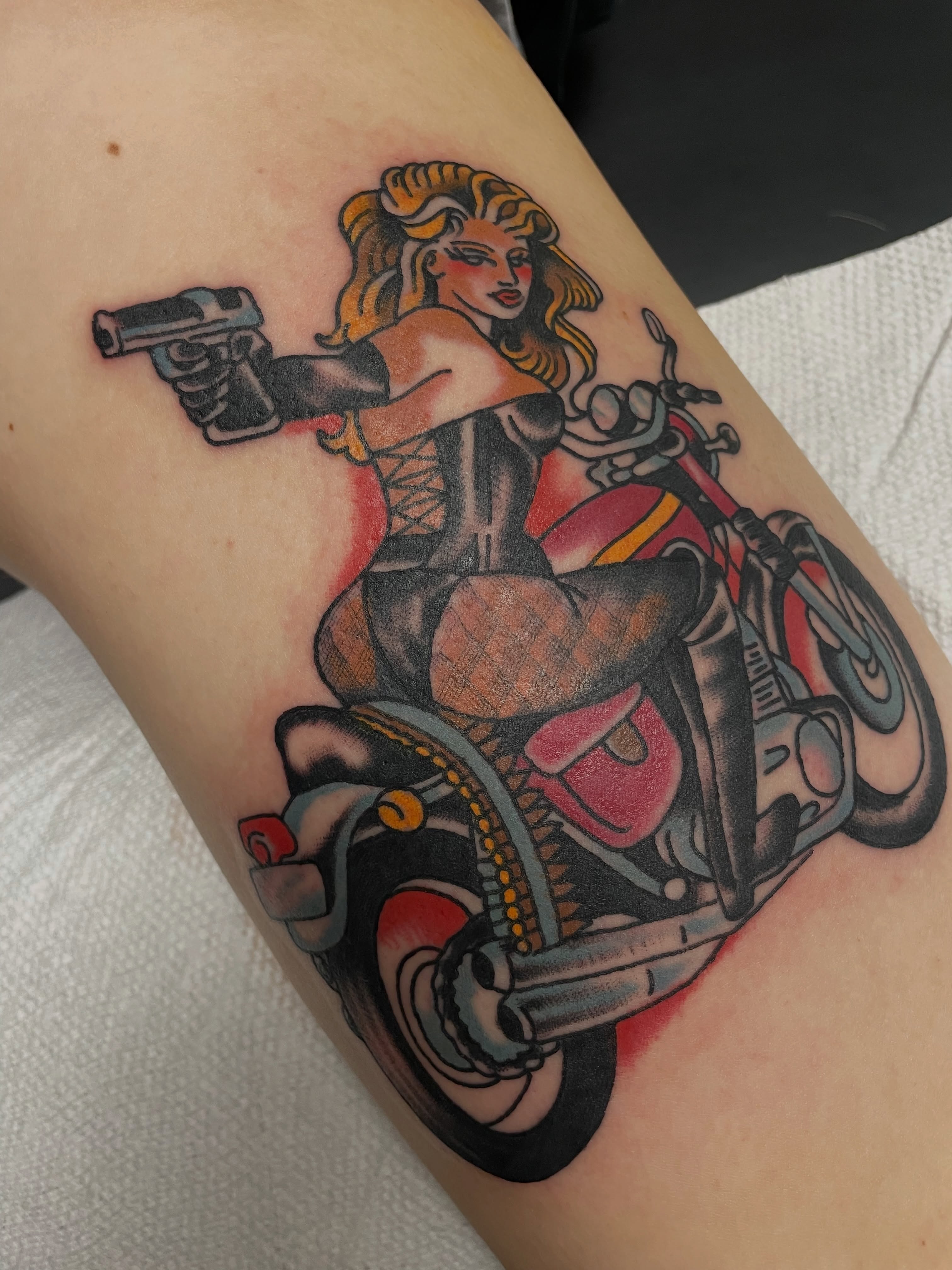 Motorcycle pin-up girl American traditional tattoo on the thigh by @pizzabref