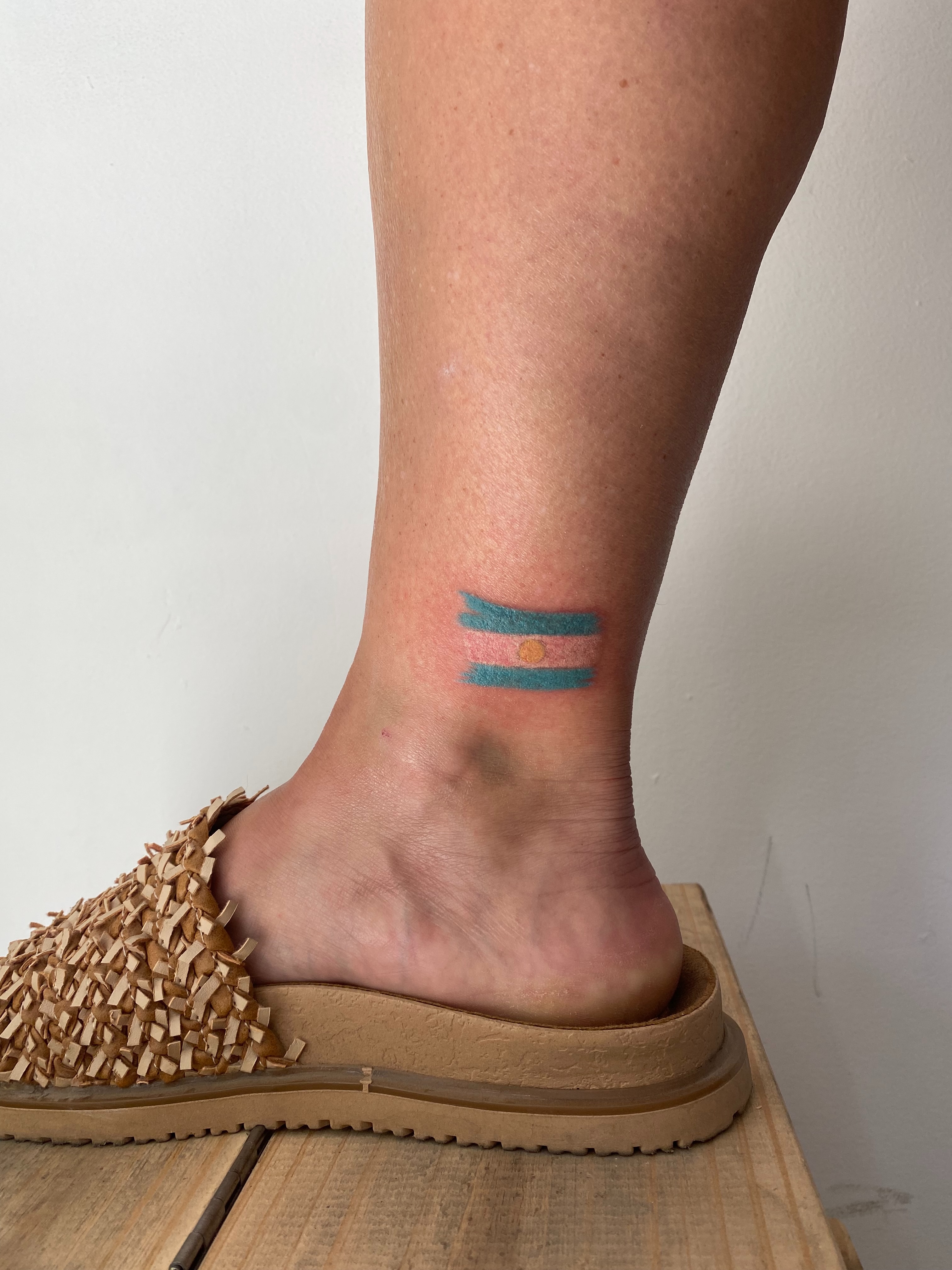 Flag dotwork tattoo on the foot by Eleana, North Miami, Florida