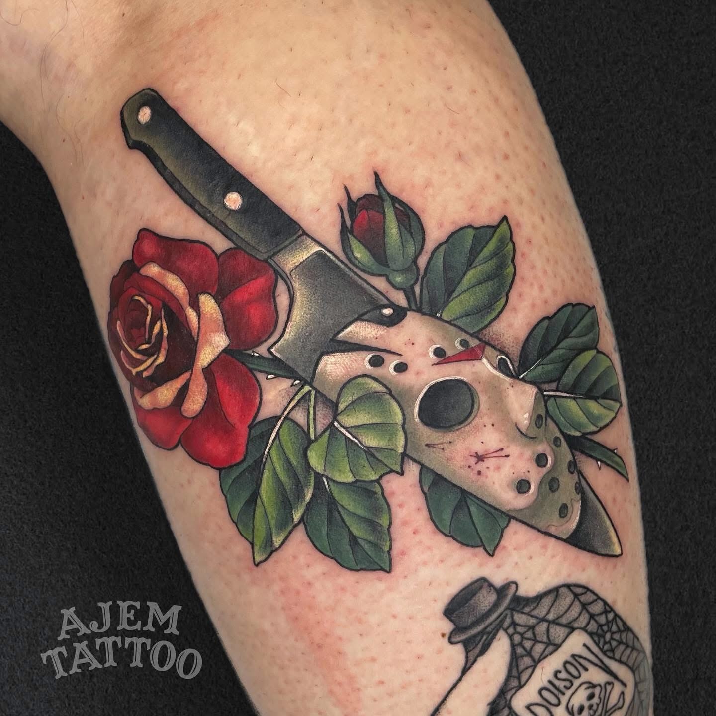 Mask and knife with roses American traditional tattoo on the forearm by Ash MacIsaac