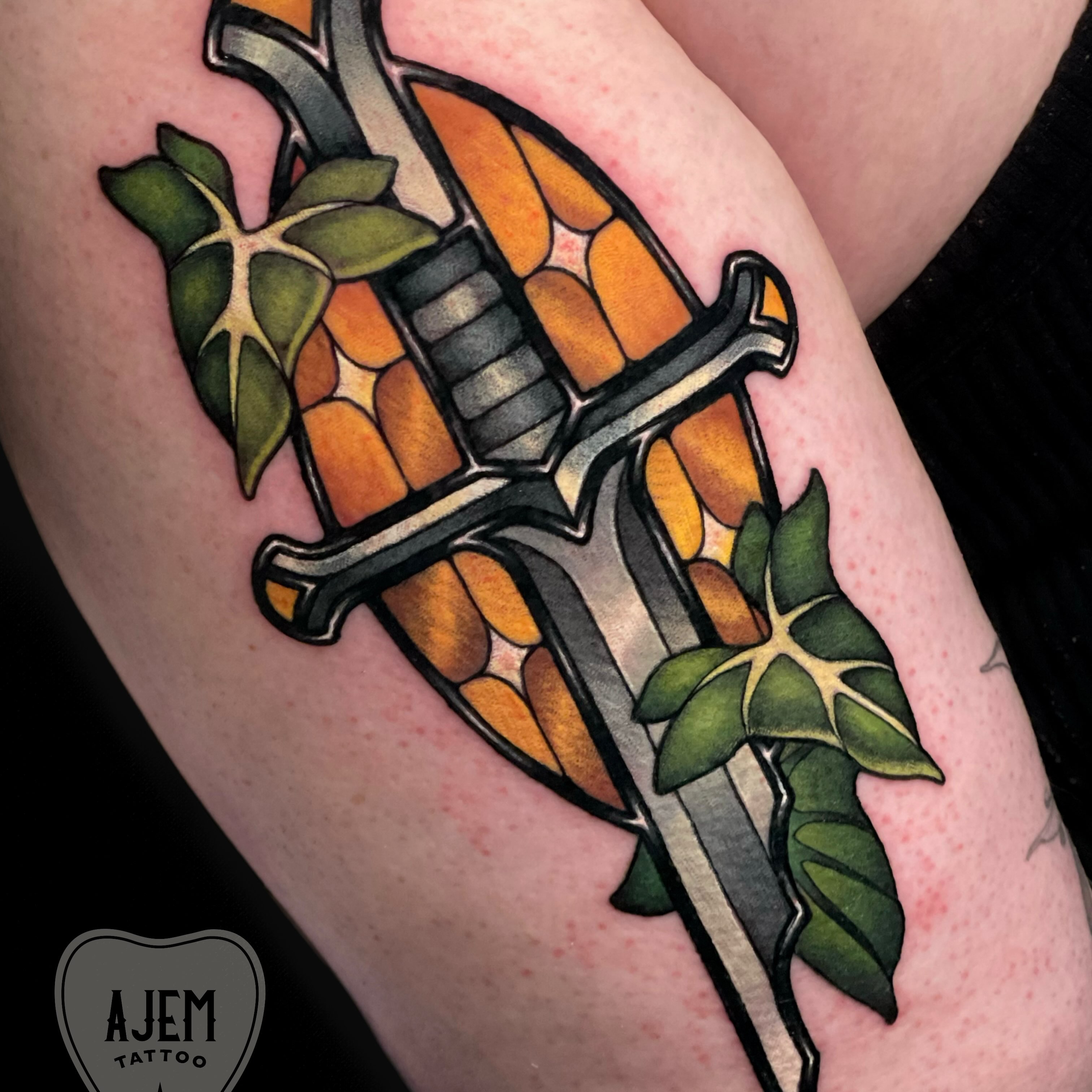 Sword and leaves American traditional tattoo on the forearm by Ash MacIsaac