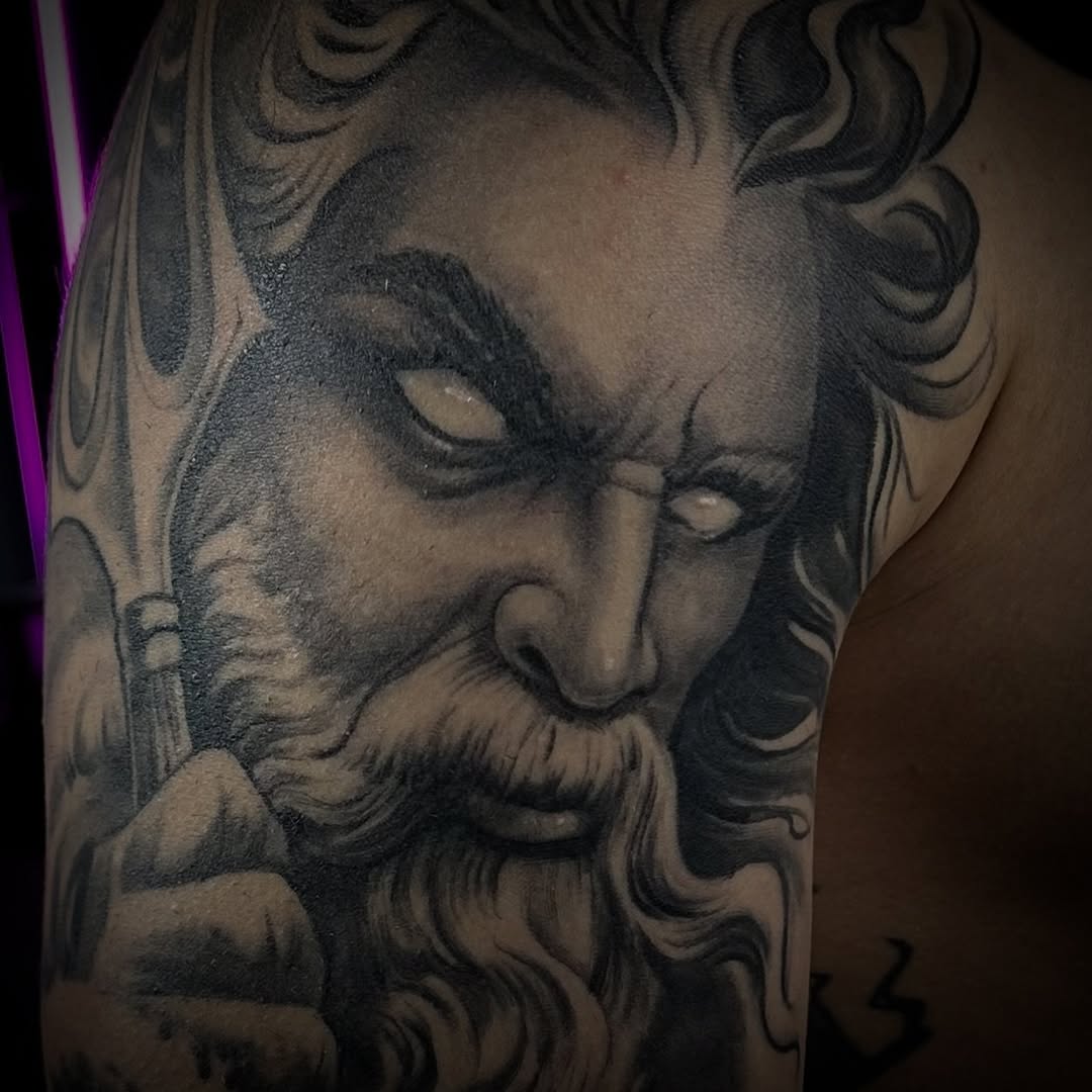 Bearded man with glowing eyes surrealism tattoo on the shoulder by Jason Oz, Denver, Colorado