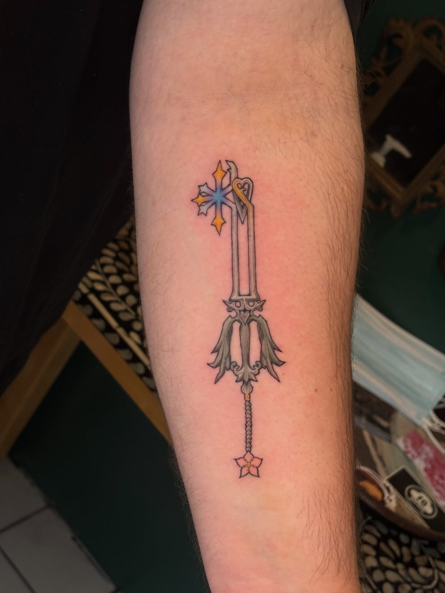 Keyblade new school tattoo on the forearm by Chloe Shay