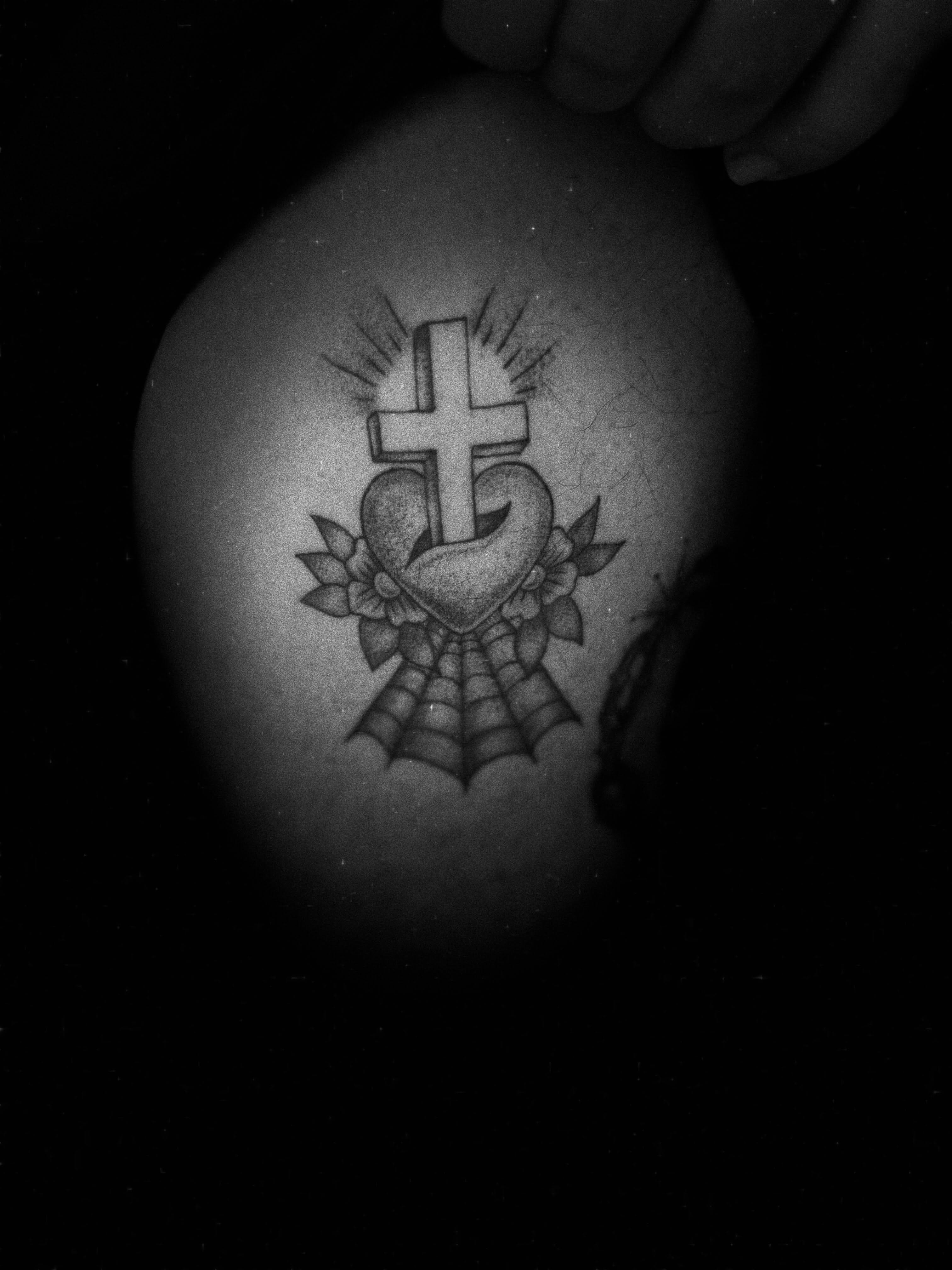 Cross and heart black and grey tattoo on the thigh by Giana Martinez, Wichita, Kansas