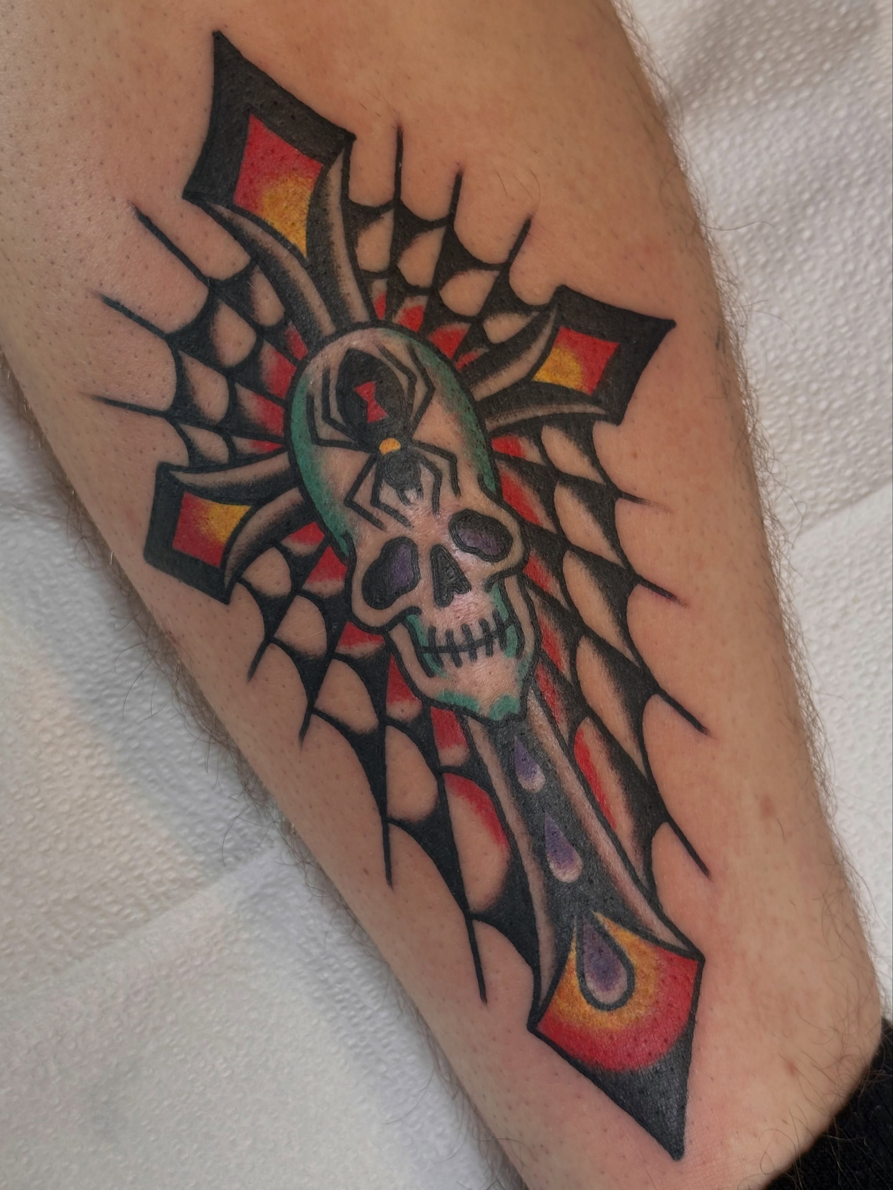 Skull with spider American traditional tattoo on the forearm by Cody Woolard, Seymour, Tennessee