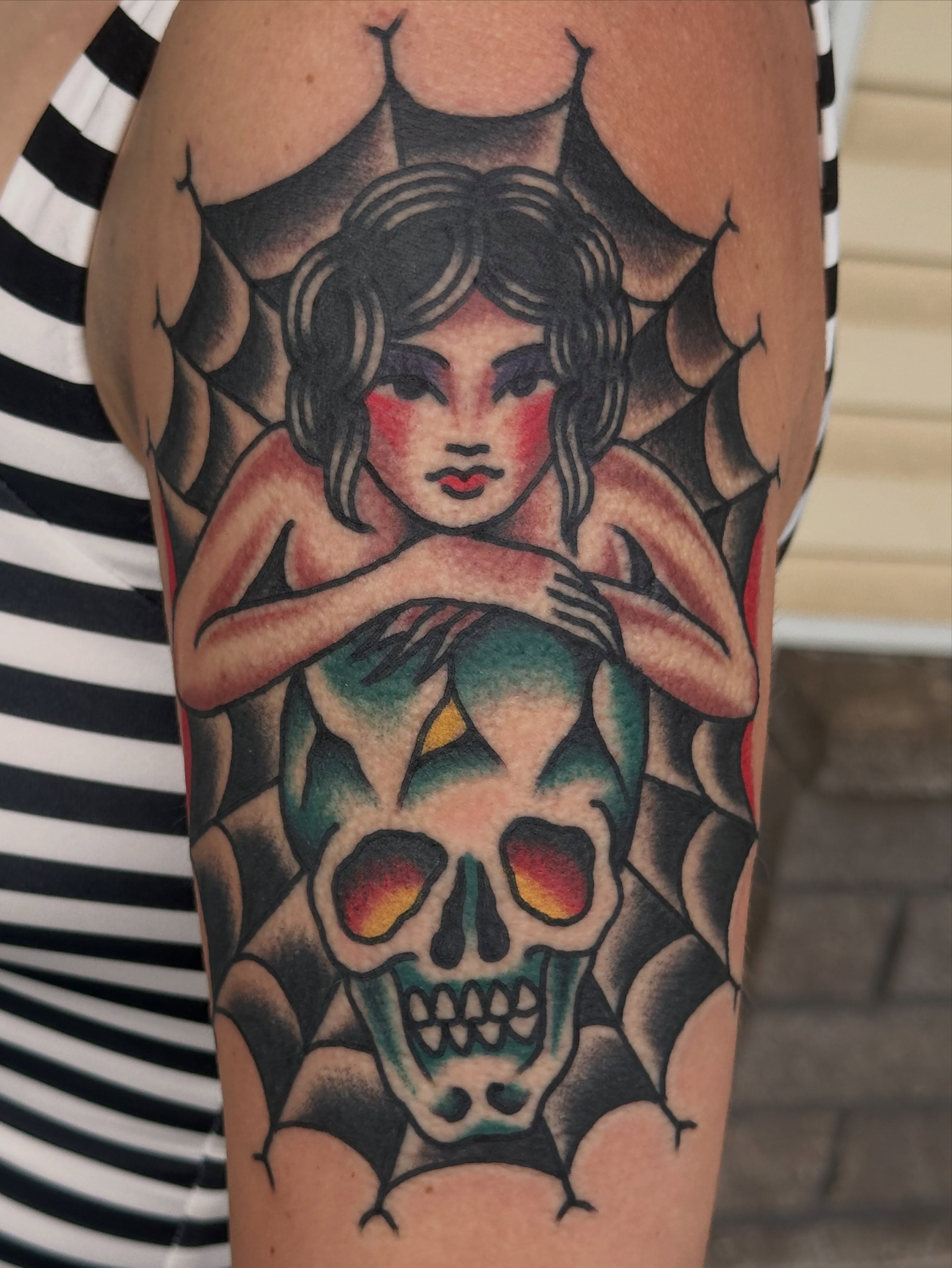 Woman with skull American traditional tattoo on the forearm by Cody Woolard, Seymour, Tennessee