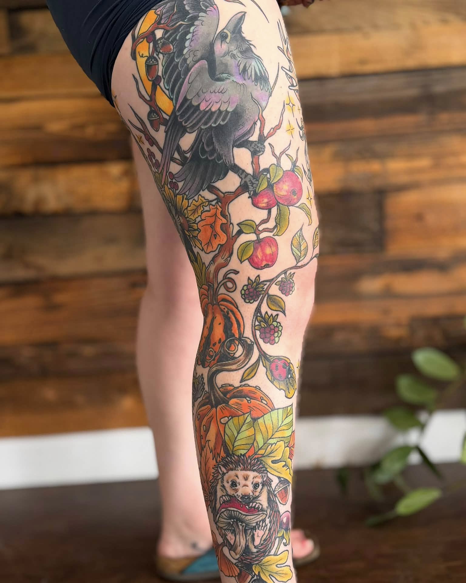 Bird and fruit tree American traditional tattoo on the leg by Eden Rose, Kalama, Washington