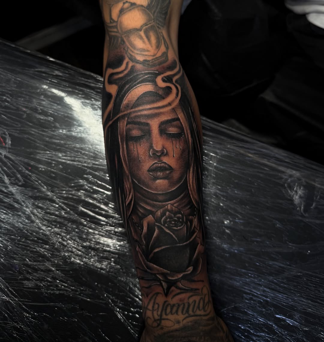 Woman with rose realism tattoo on the forearm by @samg_tat2s, San Diego, California