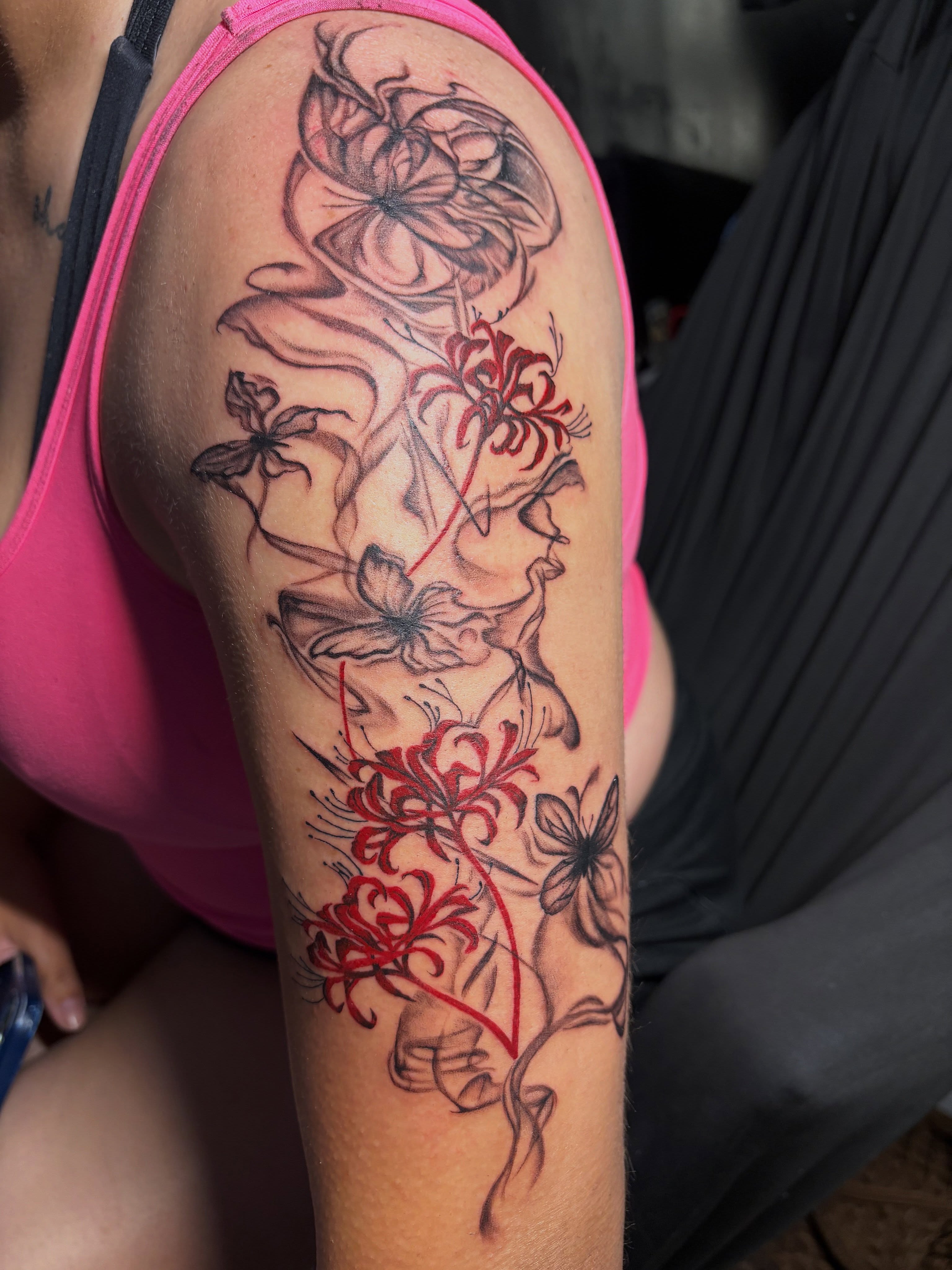 Chrysanthemums black and grey tattoo on the upper arm by Star Tattoos ⚜️