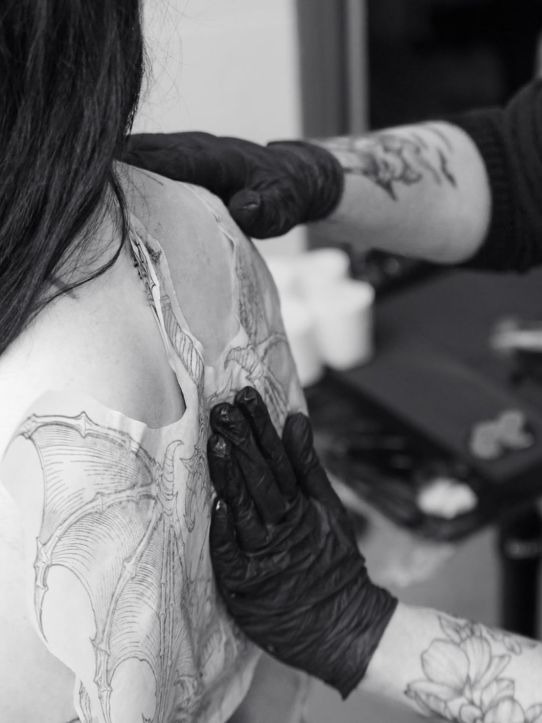 Bat black and grey tattoo on the shoulder by Brandiane Wells
