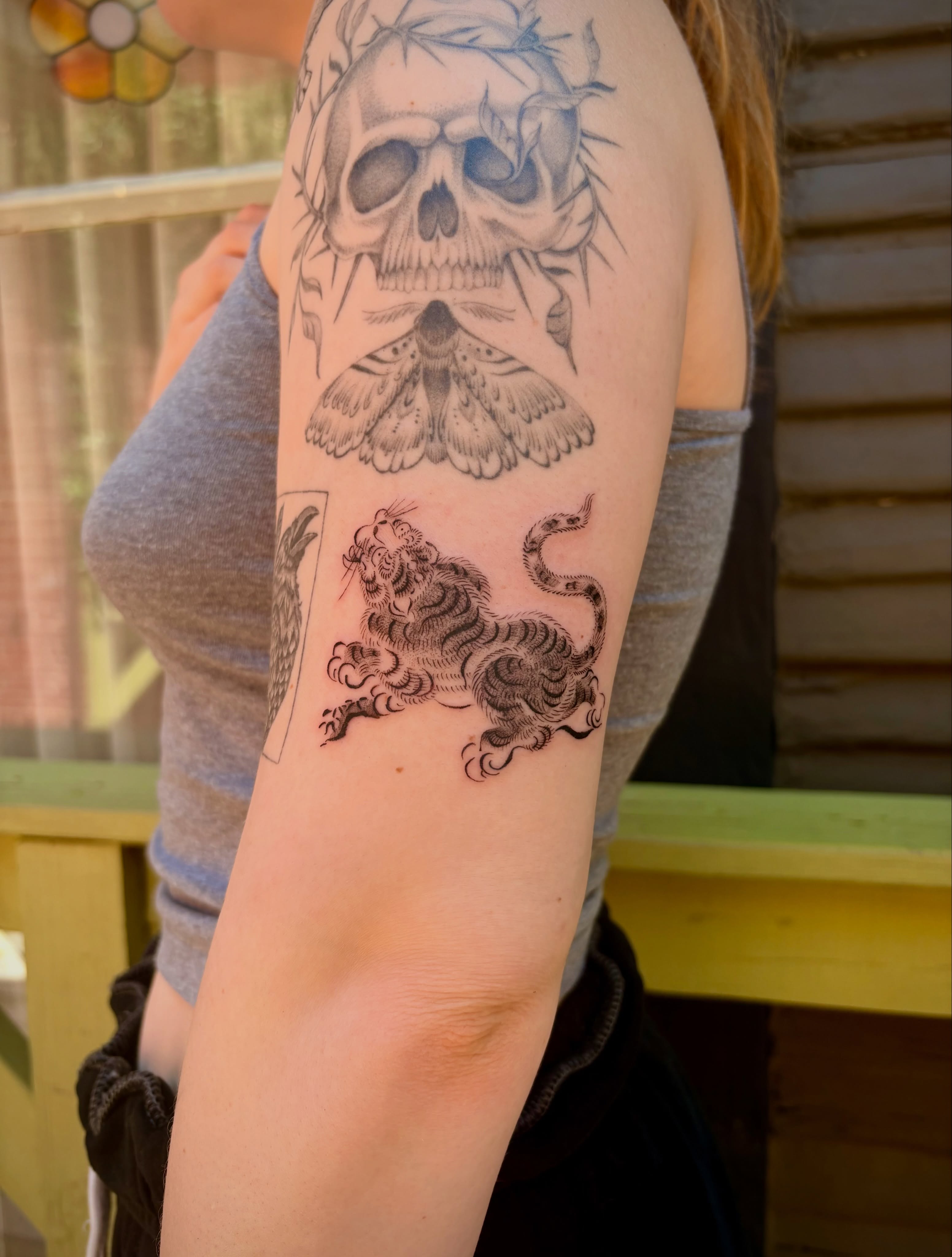 Skull moth lion snake realism tattoo on the forearm by @tattotos