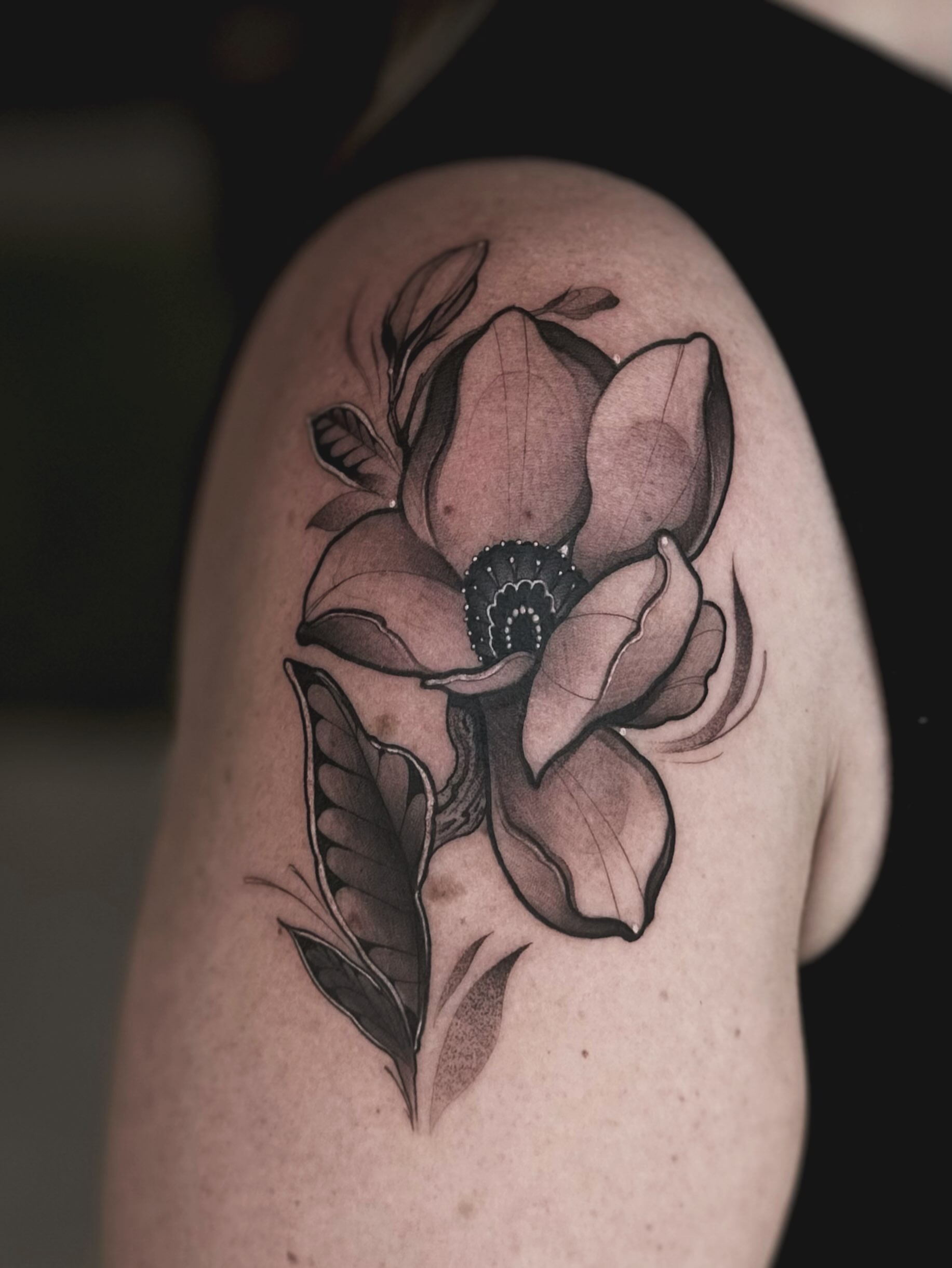 Magnolia flower black and grey tattoo on the shoulder by Mattison Fire 🔥Tallahassee Tattoo Artist