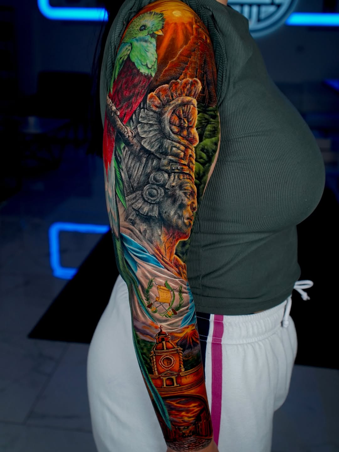 Surrealism tattoo on the upper arm by Keebs