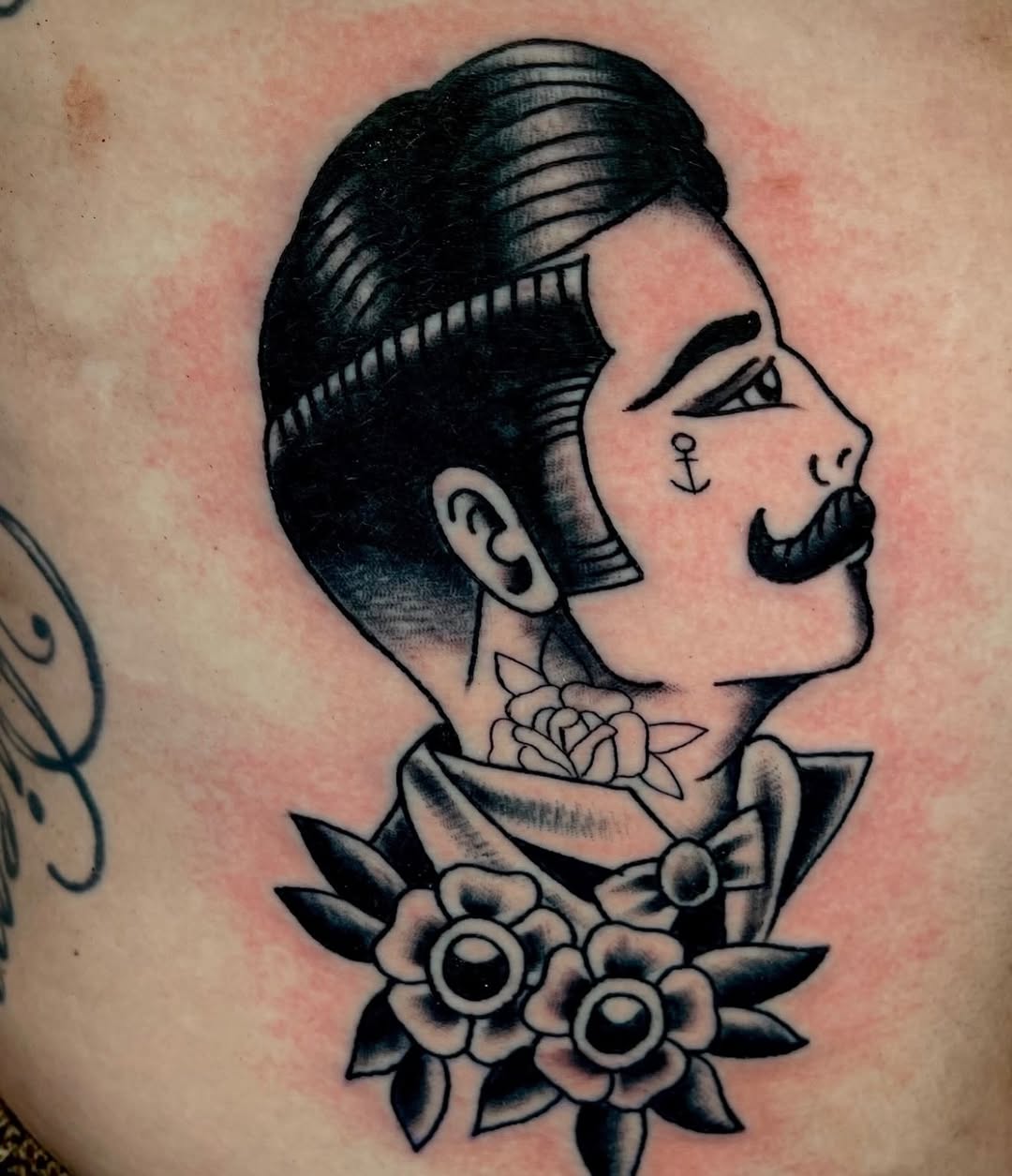 Man with mustache and flowers neo-traditional tattoo on the torso by Don Lee