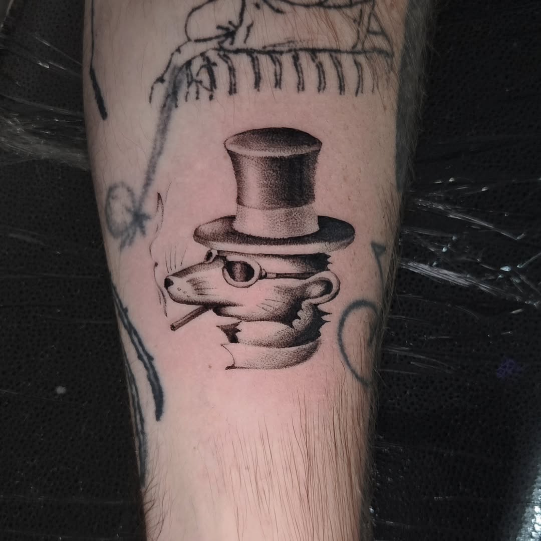 Rat in a top hat smoking dark art tattoo on the forearm by Walt