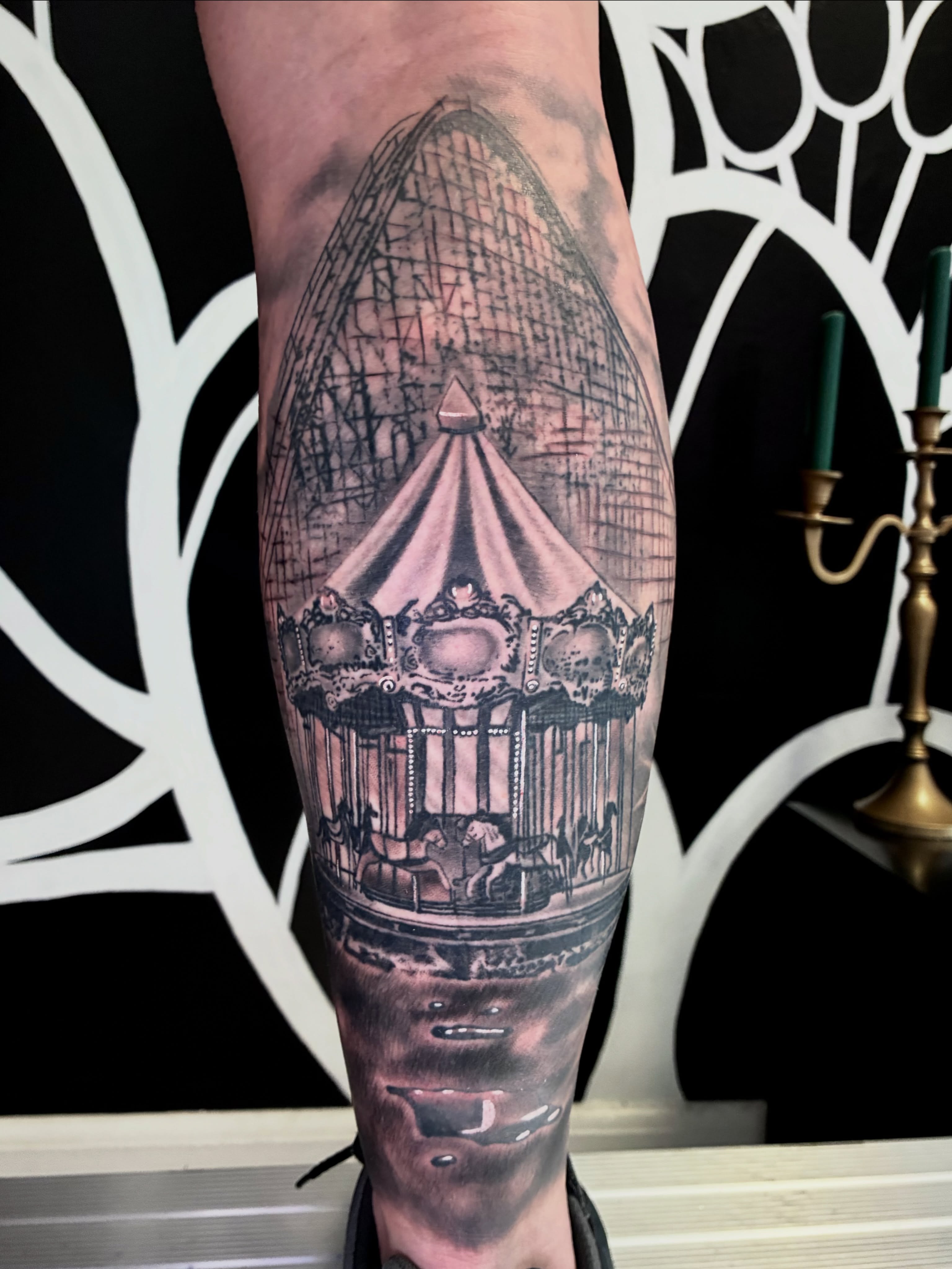 Carousel realism tattoo on the forearm by Savannah Compton