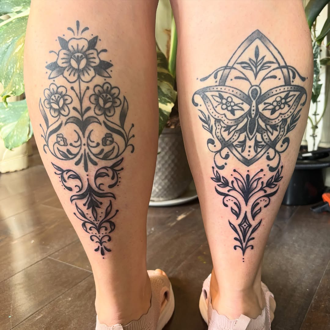 Floral and butterfly ornamental designs ornamental tattoo on the calf by Alex Green, Nashville, Tennessee
