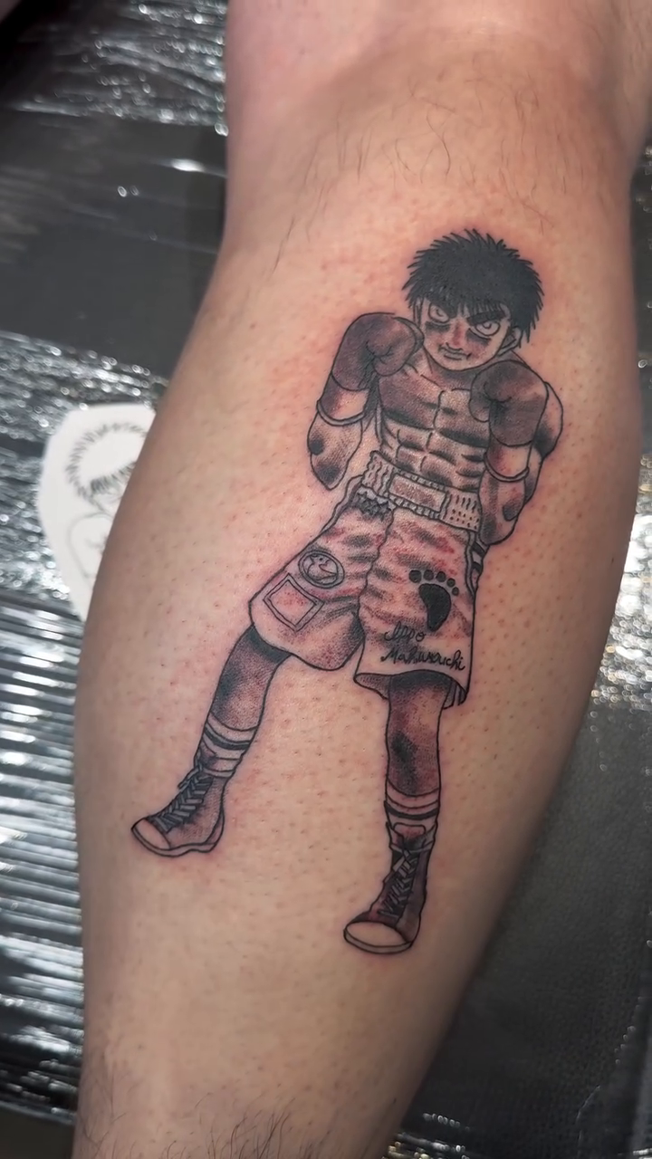 Ippo Makunouchi from Hajime no Ippo tattoo on the leg by Mercy Dean