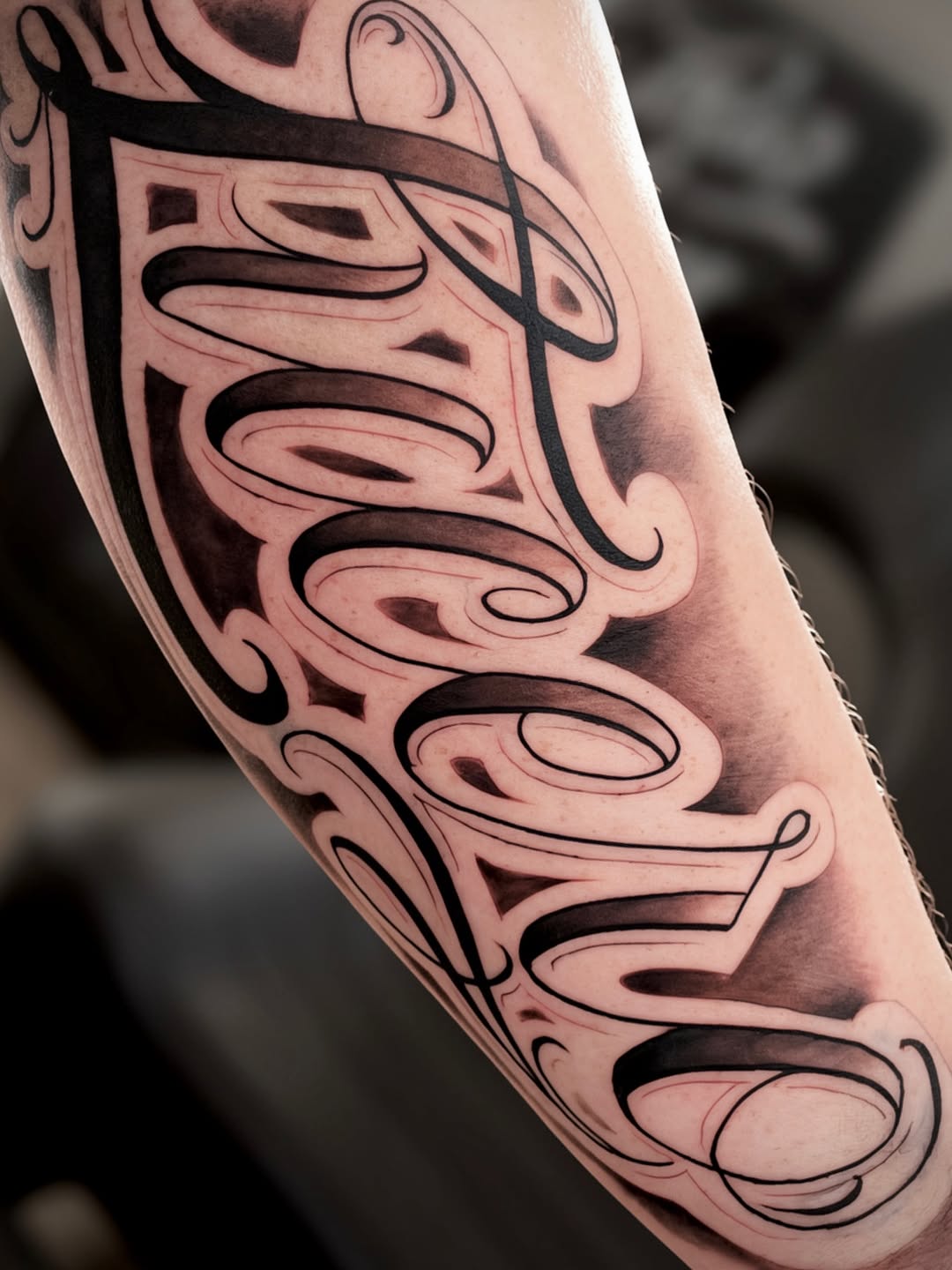 Script lettering Chicano tattoo on the forearm by ⚜️Lalo Godina Tattoo⚜️