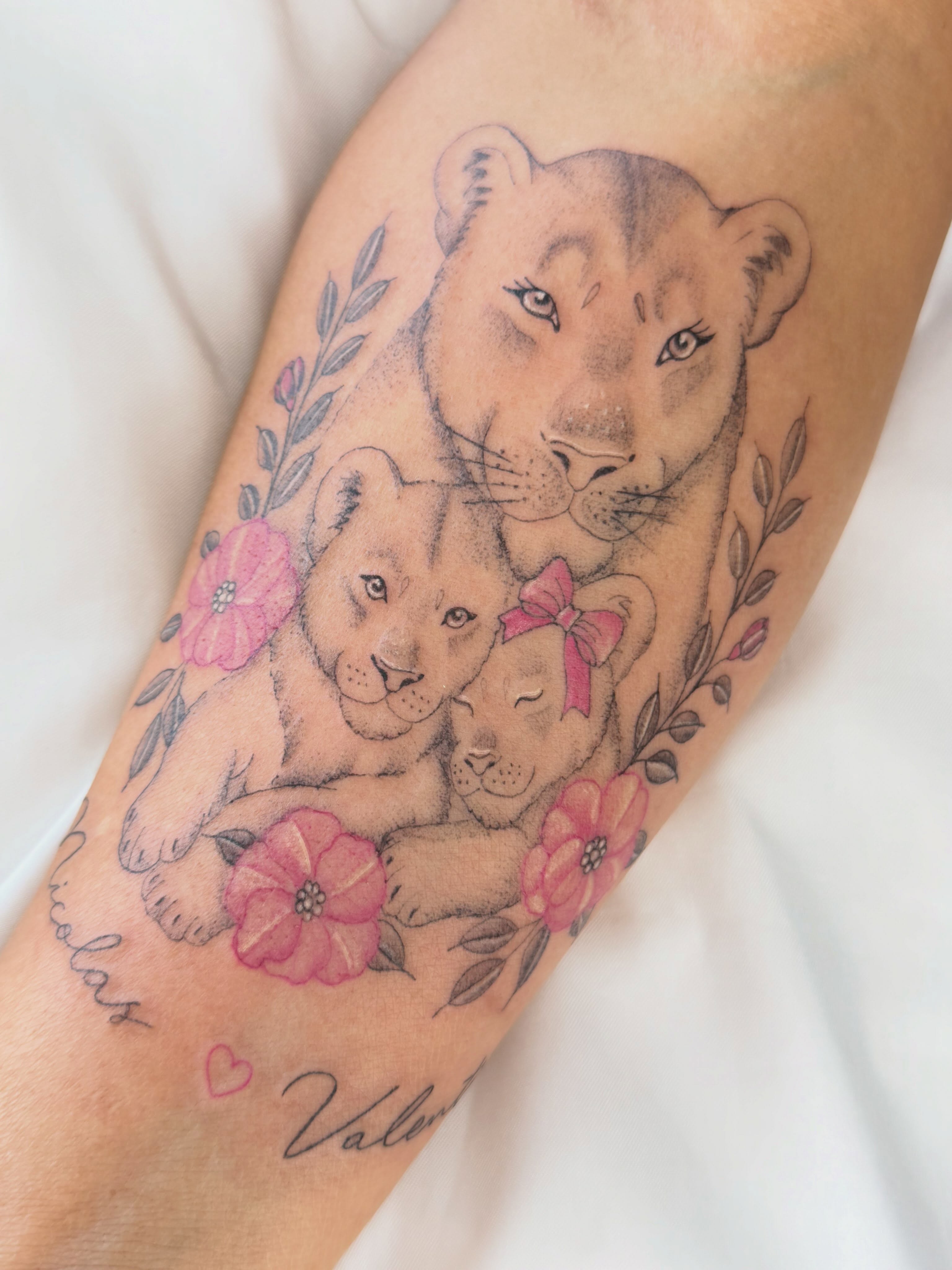 Lion family realism tattoo on the forearm by Silva Wellen