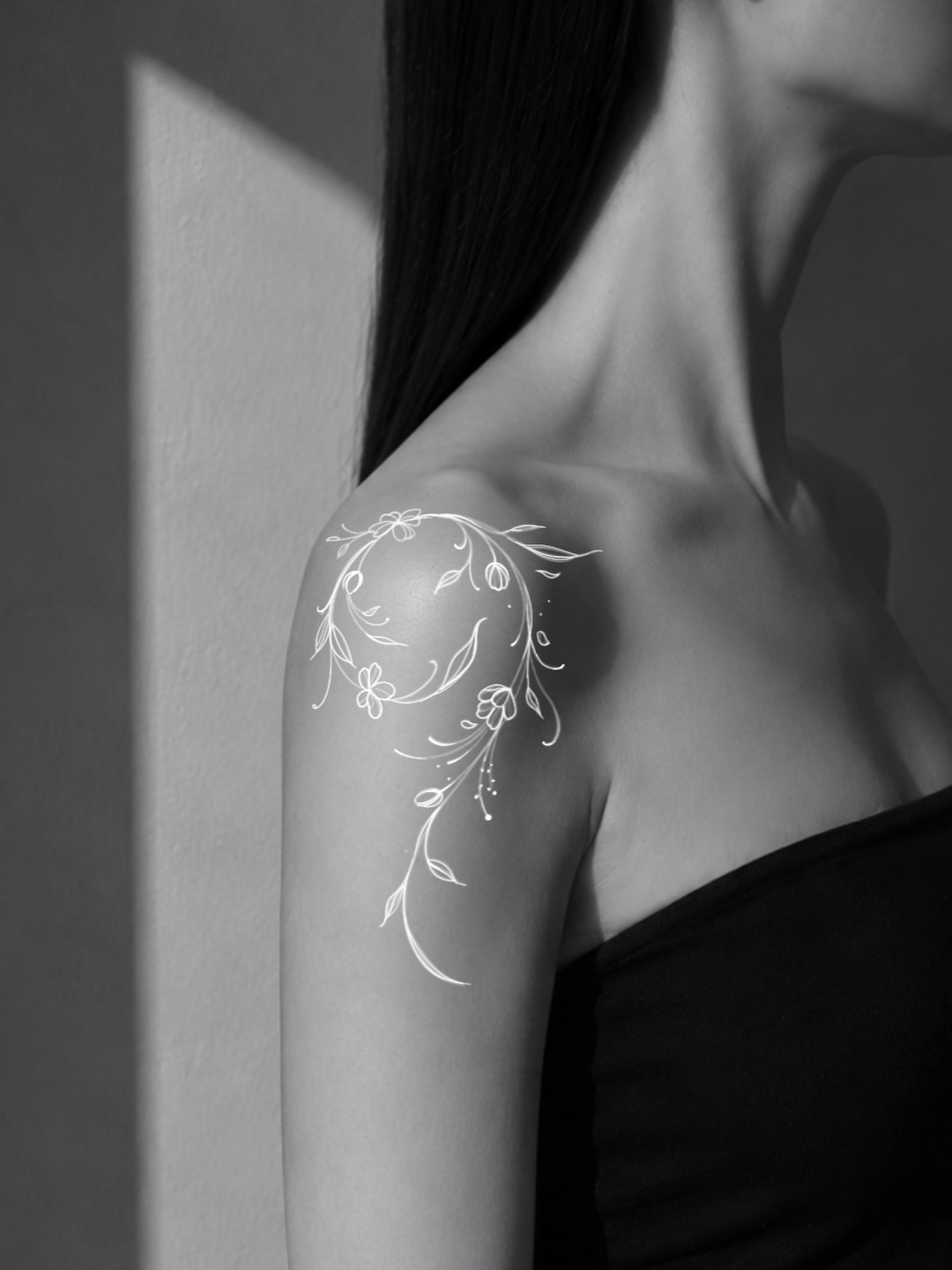 Floral vine fine line tattoo on the shoulder by Victoria