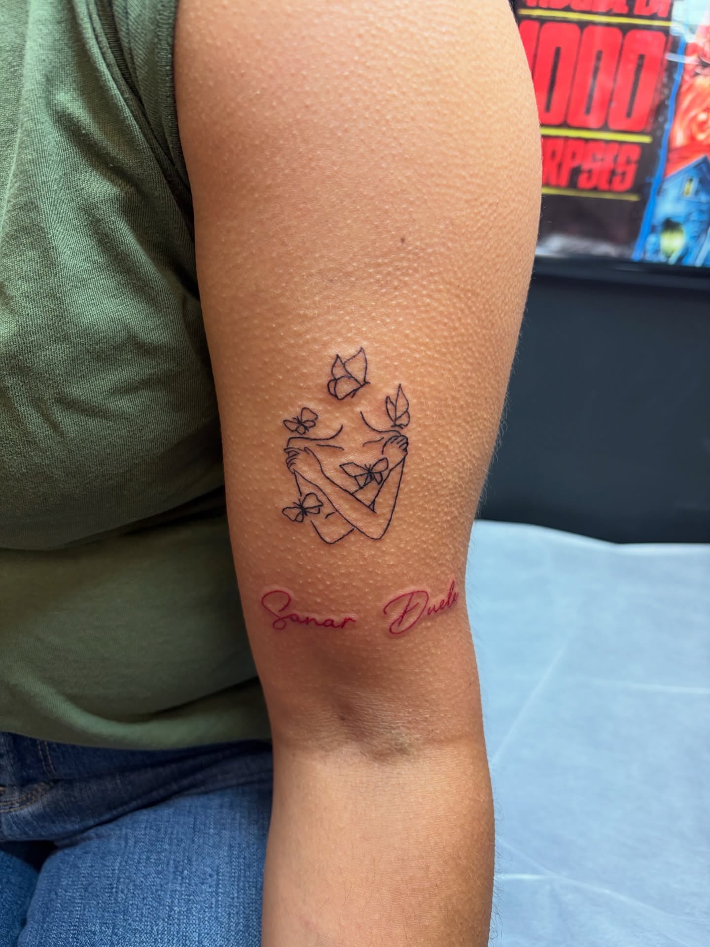 Woman with butterflies fine line tattoo on the forearm by Fran