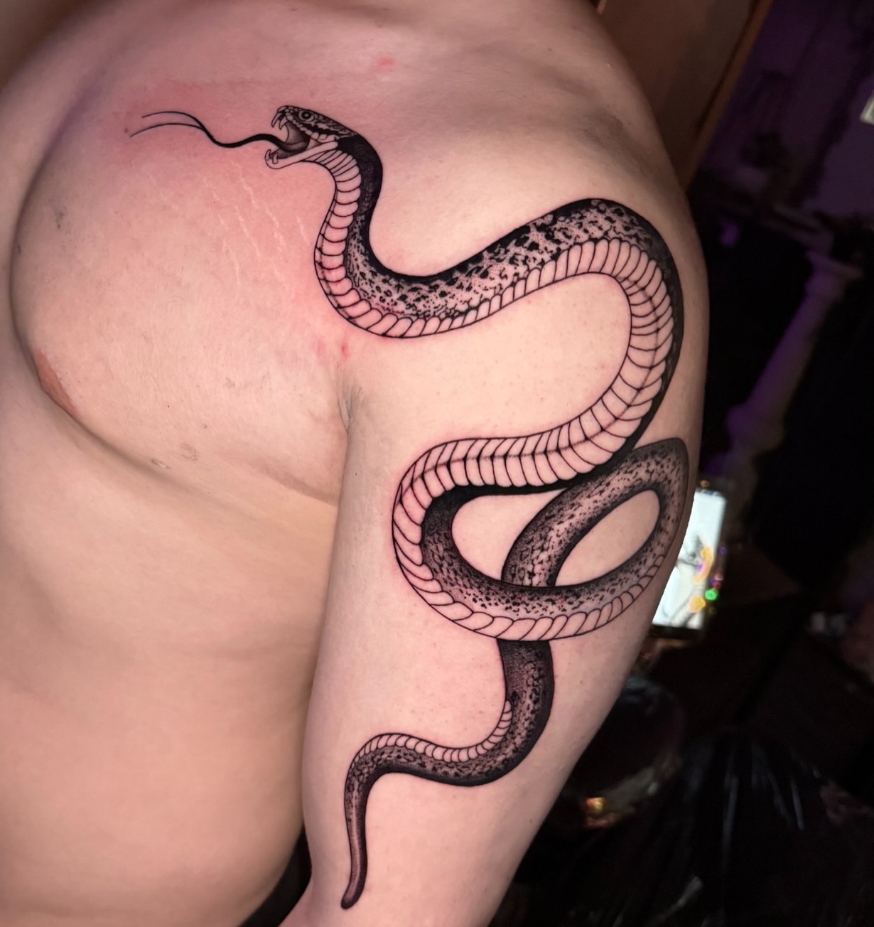 Snake black and grey tattoo on the shoulder by Tattoo Artist Vanessa