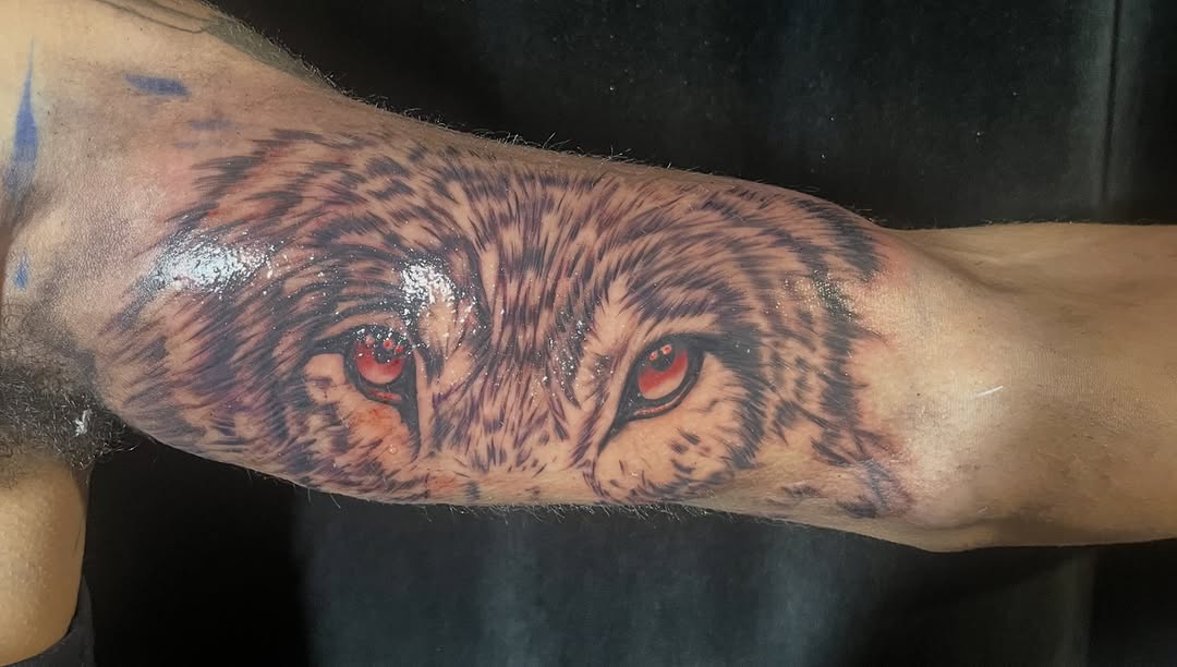 Wolf eyes realism tattoo on the forearm by SpicyMvstardInkk
